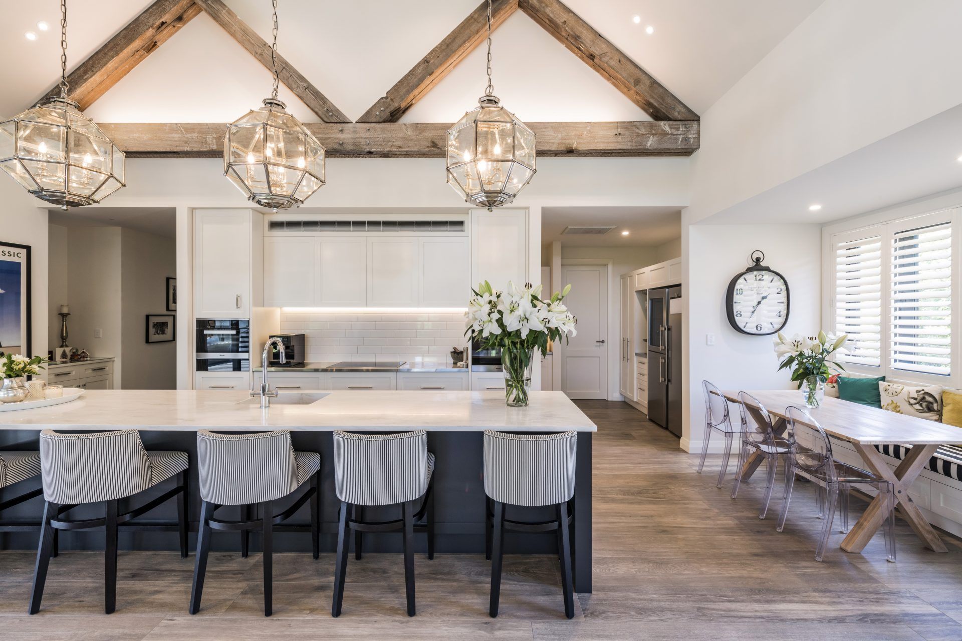 A classic white kitchen also acts as an informal dining area.