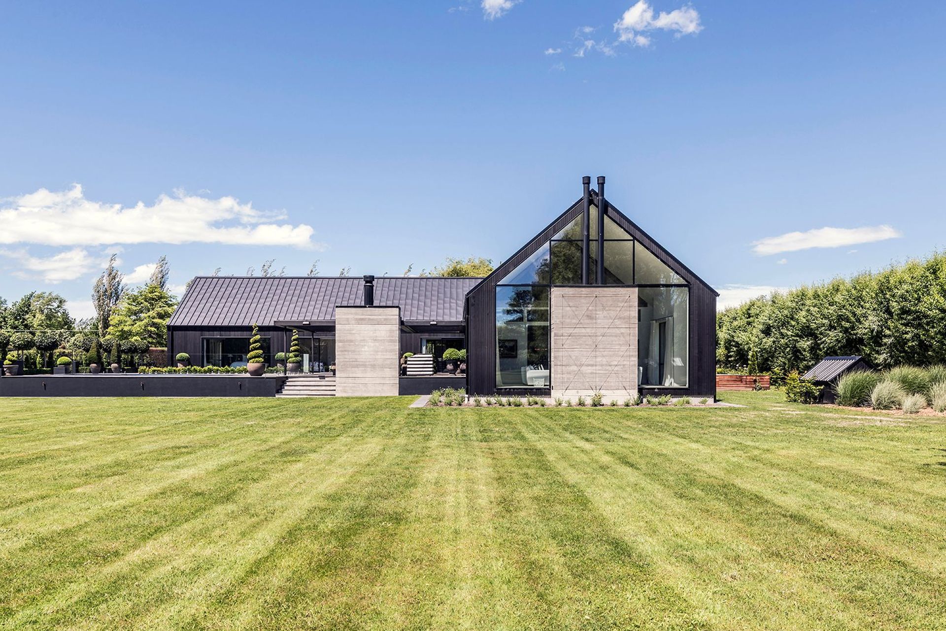 This striking home sits on a lifestyle block on the outskirts of Christchurch.