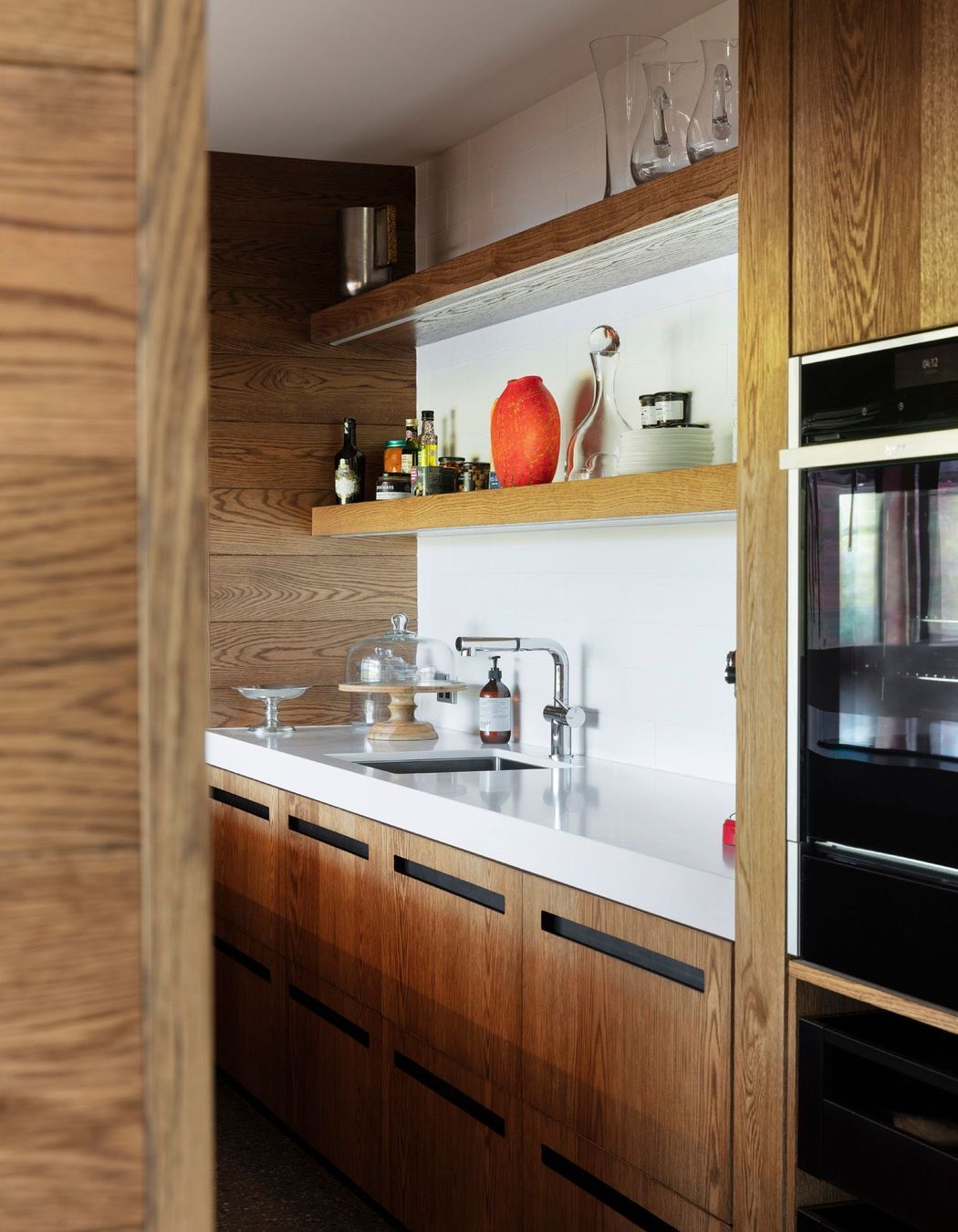 The scullery incorporates high-quality appliances, such as these Neff ovens..