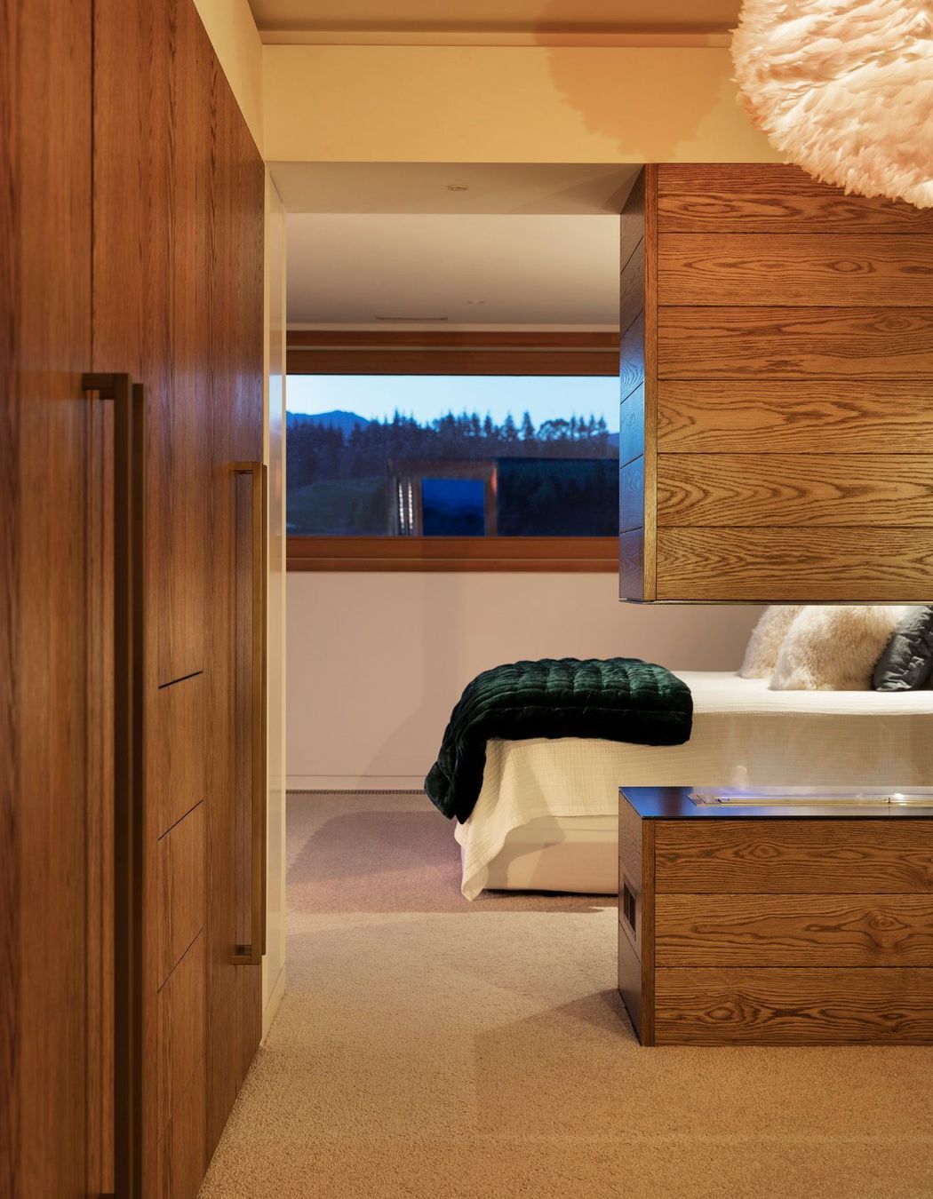 The master suite utilises bespoke oak cabinetry for plenty of storage.