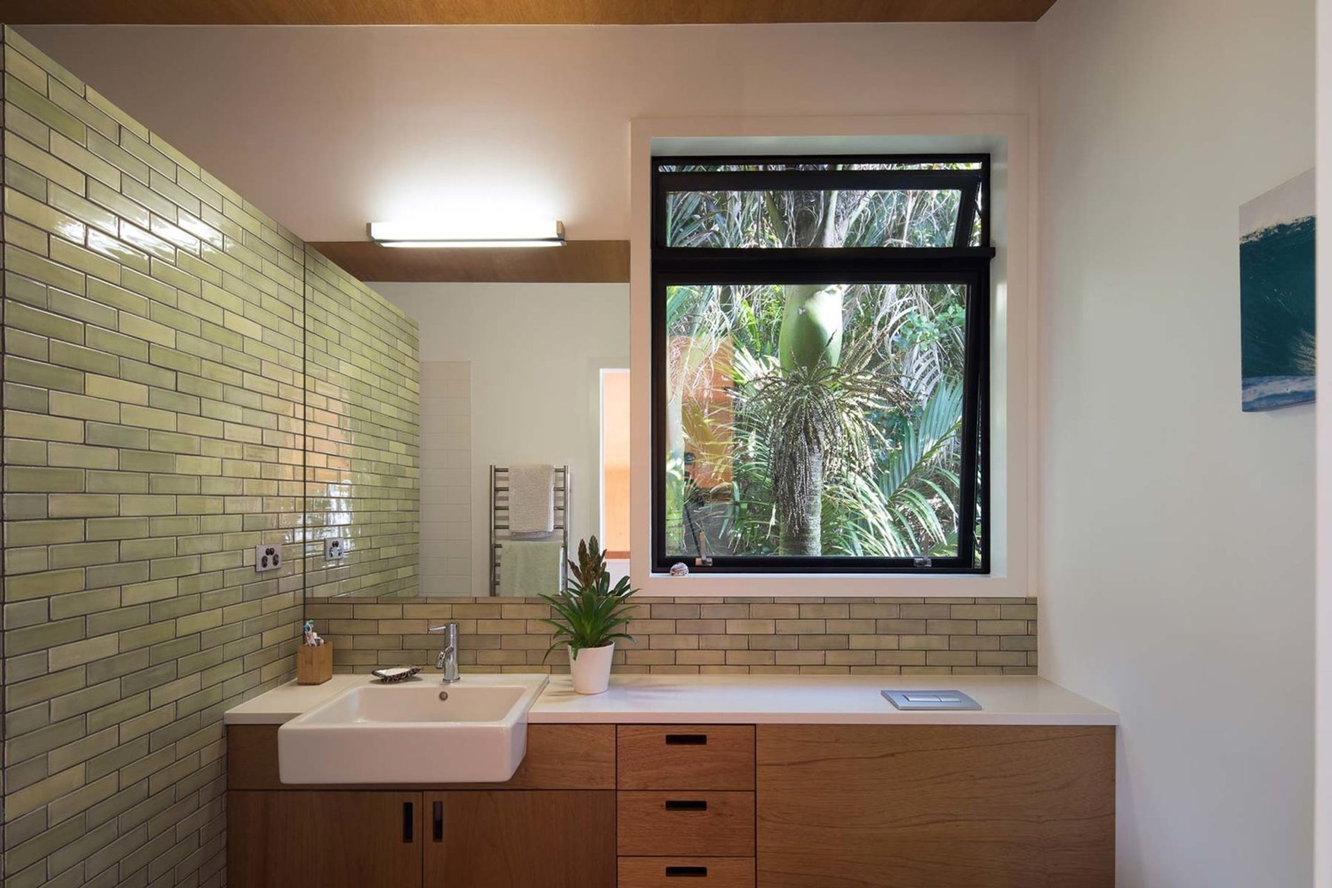 Use of green tiles connects the bathroom spaces with the outside environment, bringing the ‘outside’ to the ‘inside’.  