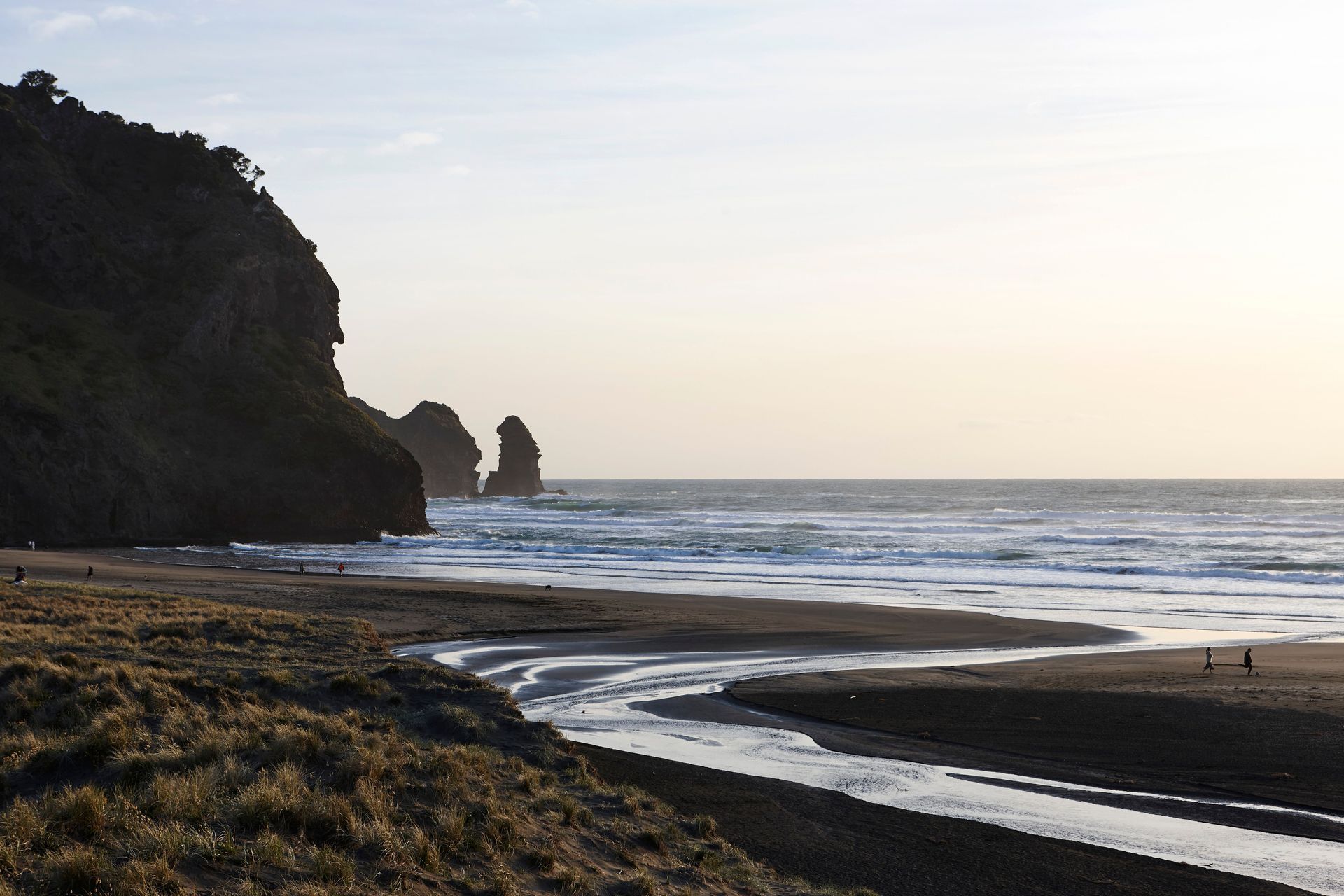 Piha: Black sand, relentless ocean, jagged basalt and a sky that dances between fiery white and violent seething black.