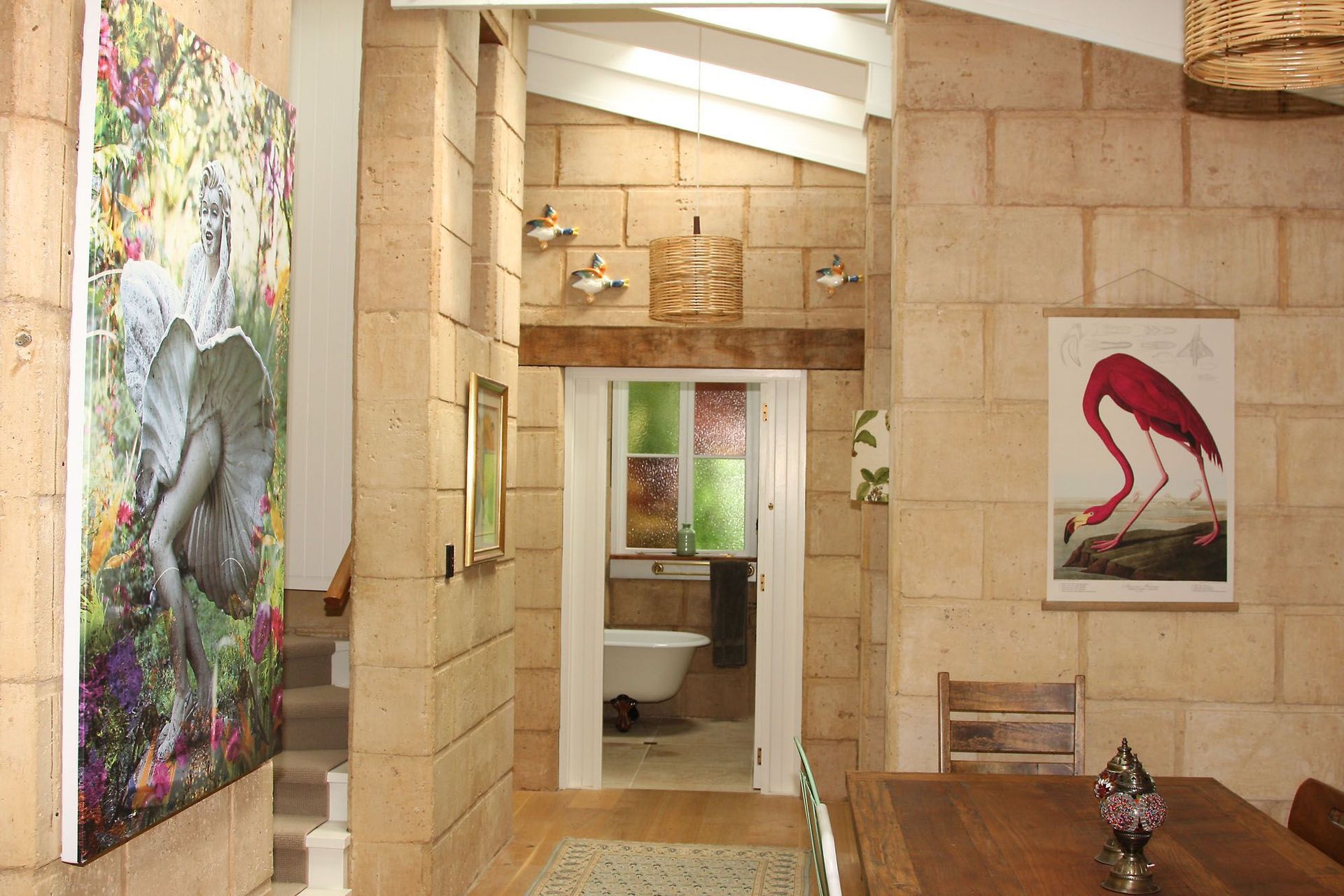 The homeowner is an avid collector, and so all accessories have meaning and significance.  The eclectic collection ranges from a 1000-year old bronze Buddha statue, to a poster of a flamingo.