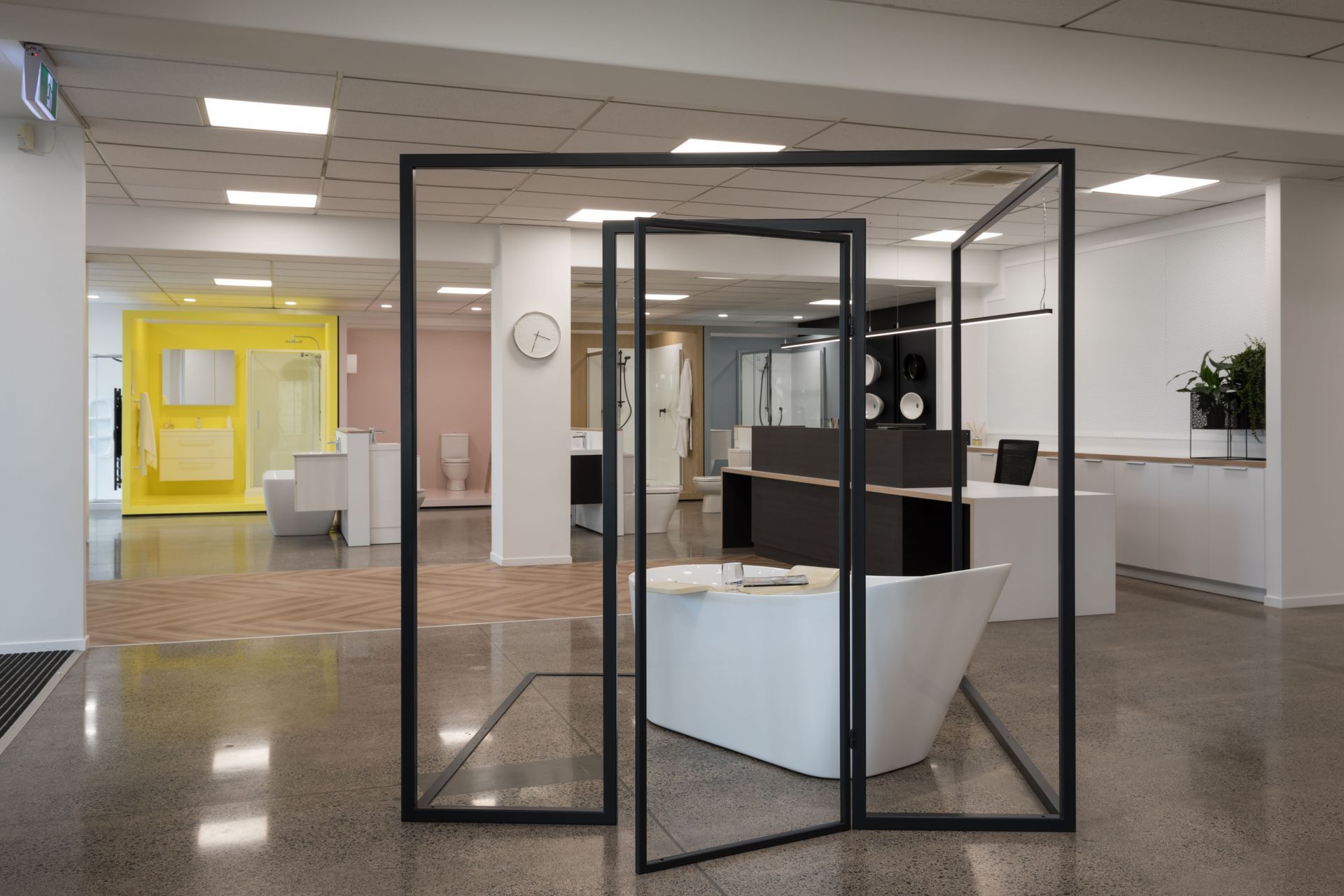 The suggestion of a room within a room, framed in steel is the showroom centre piece.