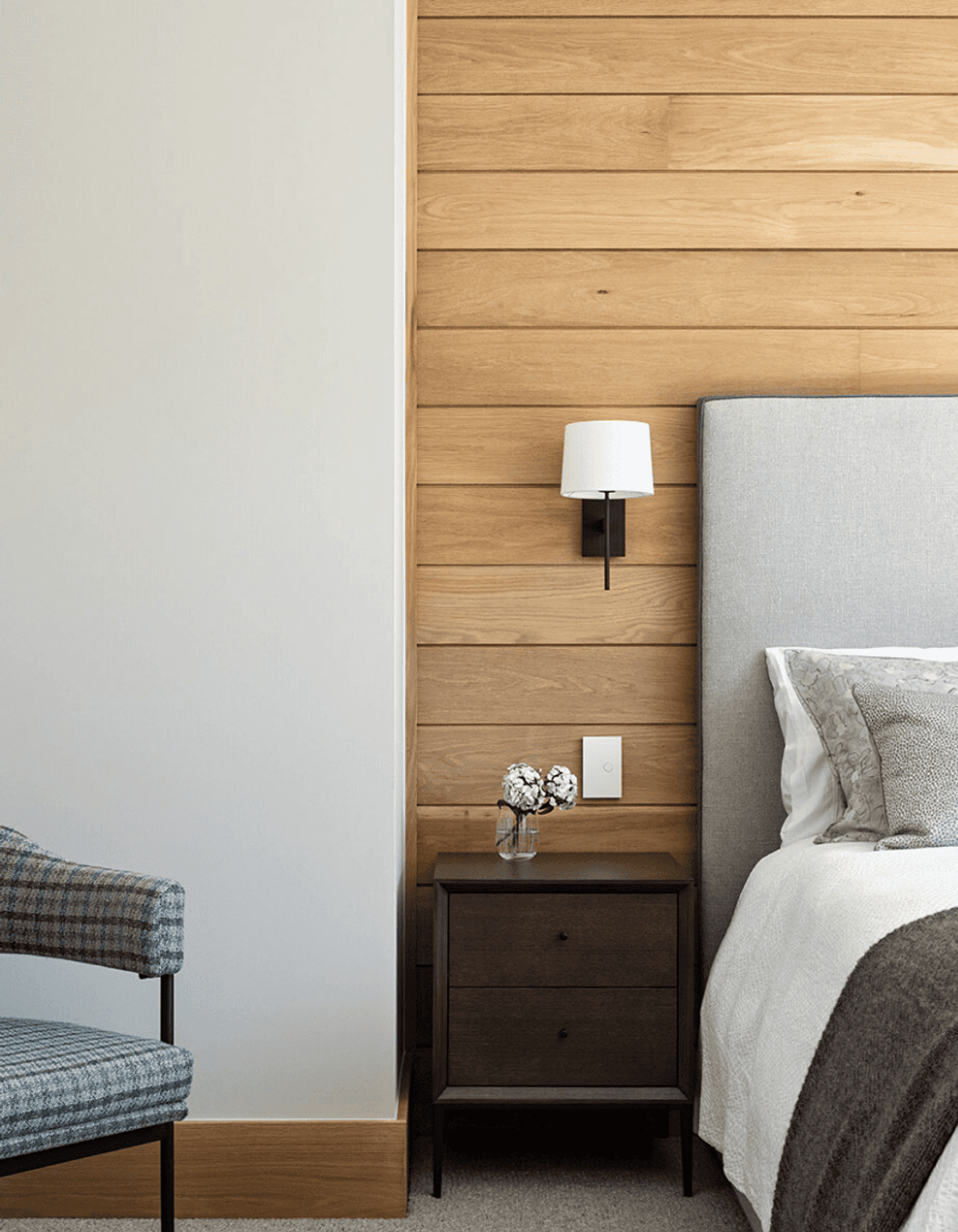 Oak timber lining in some of the guest rooms ties the material palette back to the land.