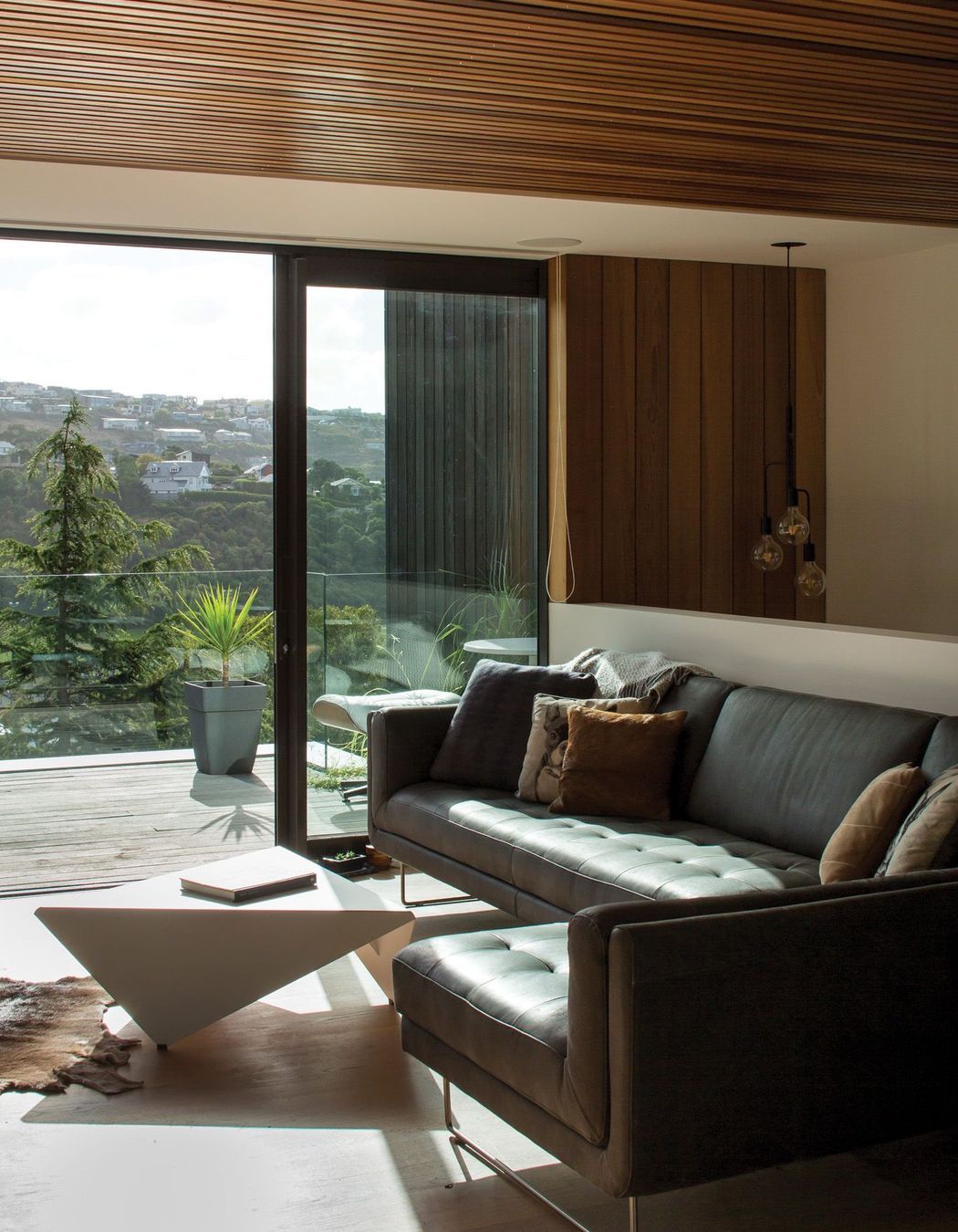 The snug opens onto a deck in front of the lap pool.