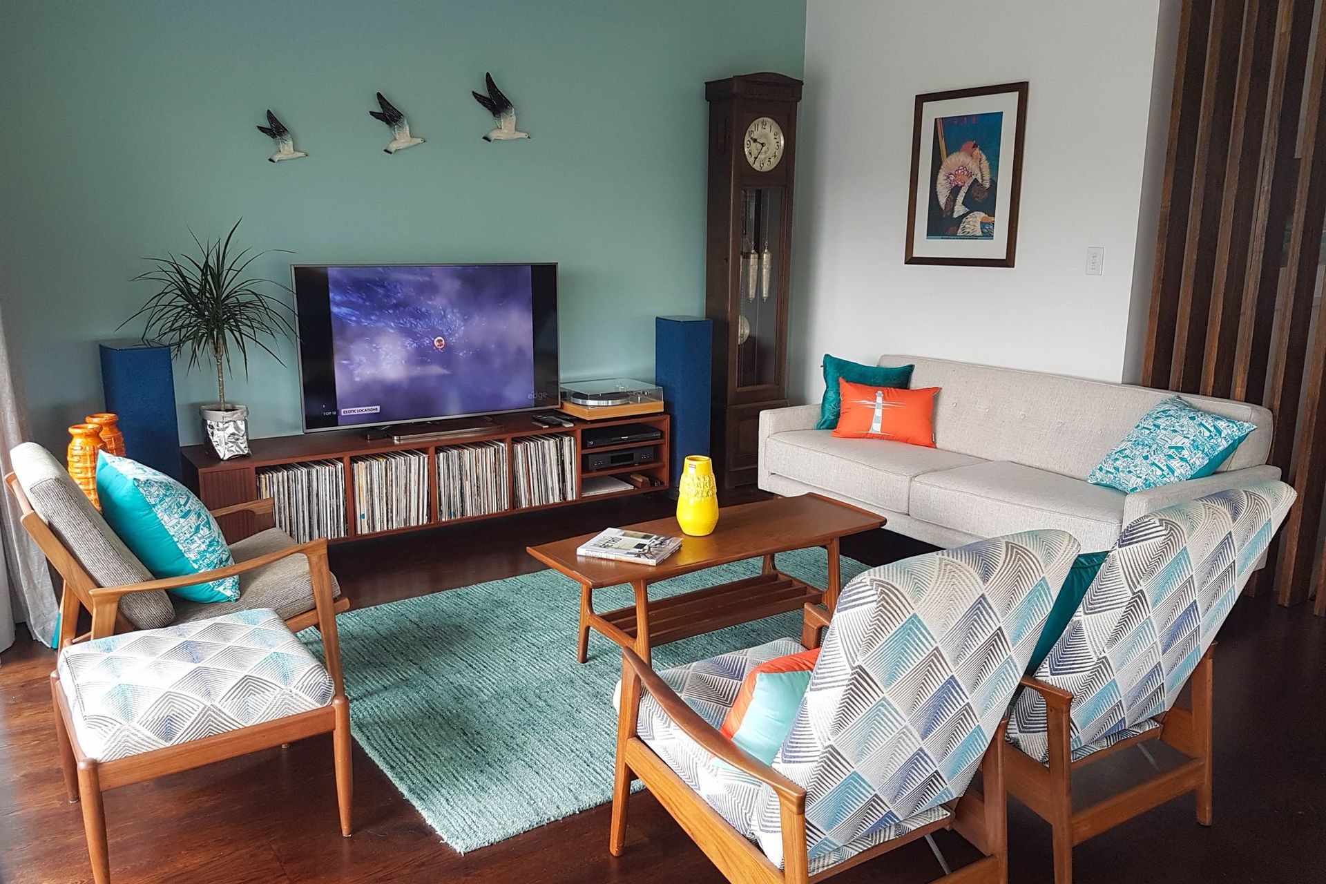 An open plan living area on a beach front apartment with a mid-century modern connection