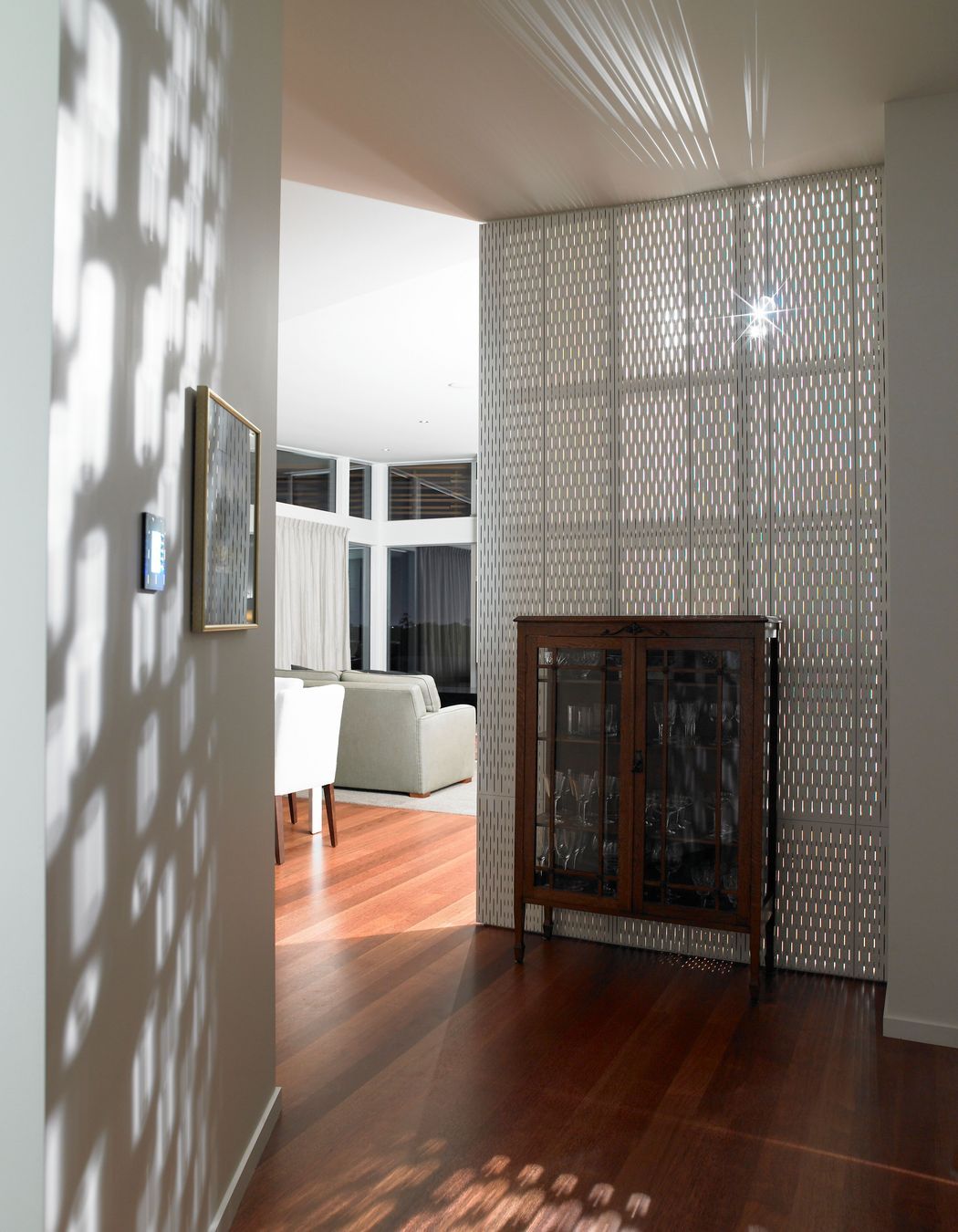 Heritage glass cabinet contrasts with the modernist textures.