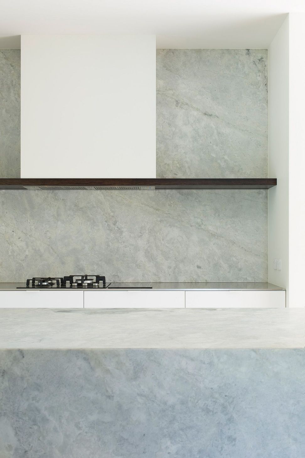This low-maintenance kitchen is crisp and clean like the exterior of Ryan House.