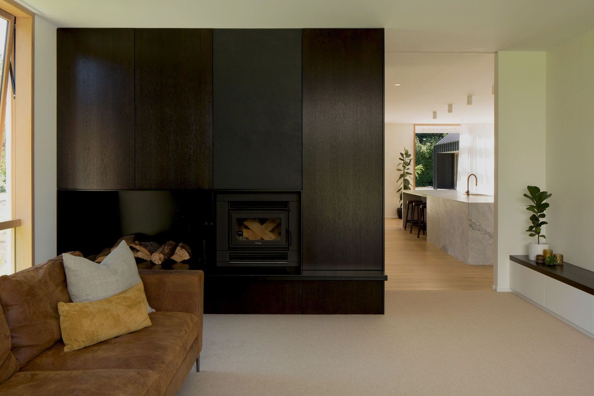 One of the lounge areas has a fireplace built into the back of the dining room cabinetry.