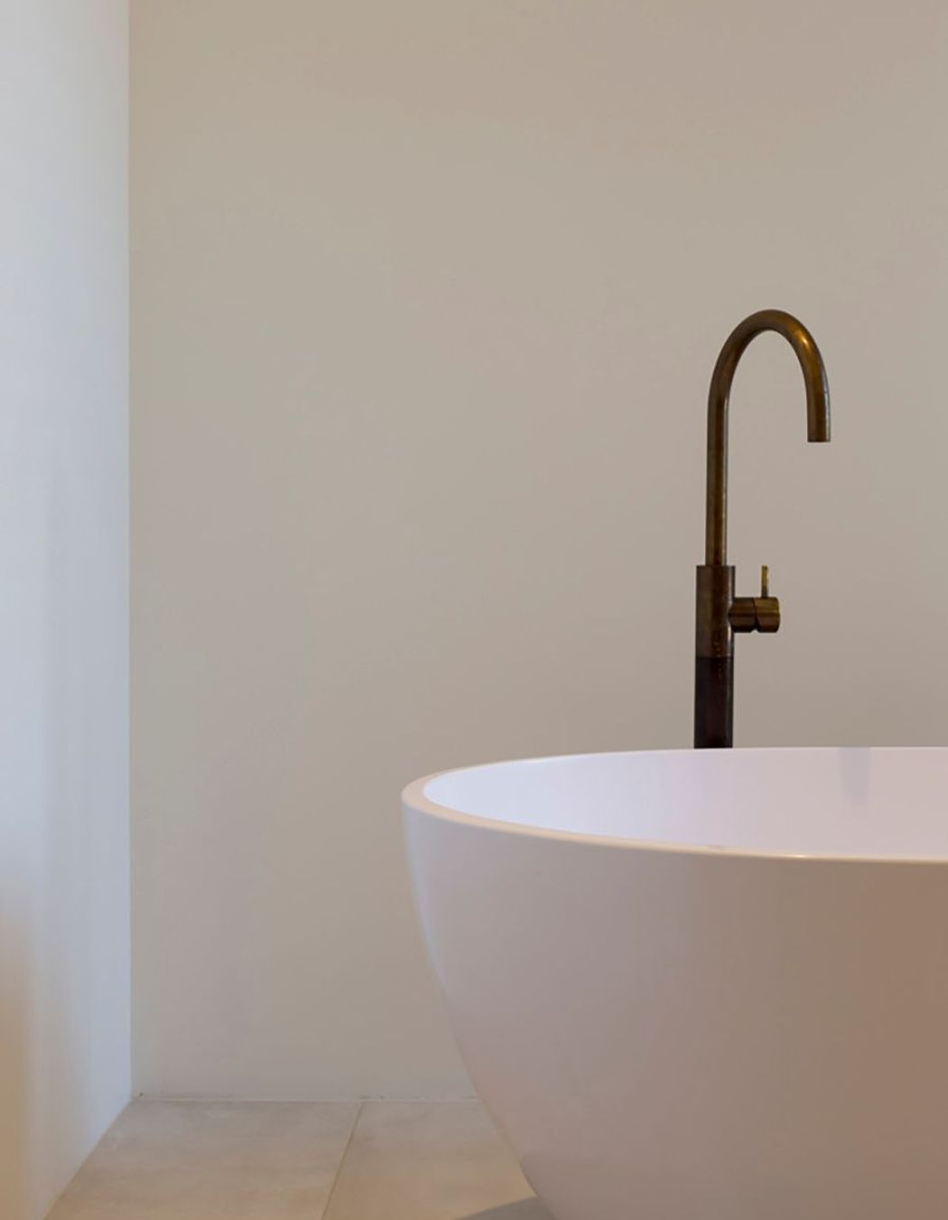 The 'Egg' freestanding bath with brass tapware from Plumline.