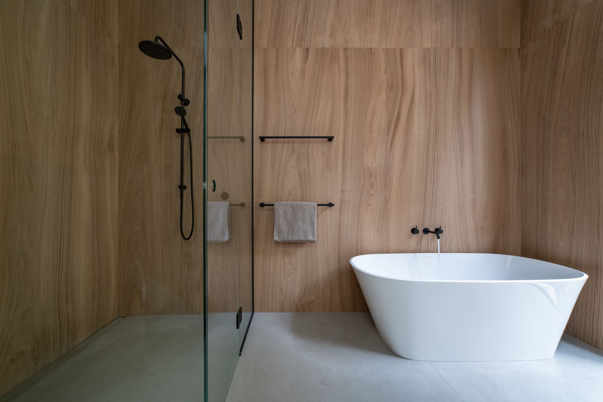 Oversized timber-look tiles create a peaceful, calming space in the ensuite bathroom, consistent with the palette in the rest of the home.