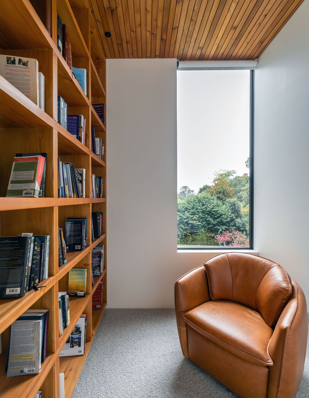 Full-height bookshelves were incorporated to house the owners' book collection. 