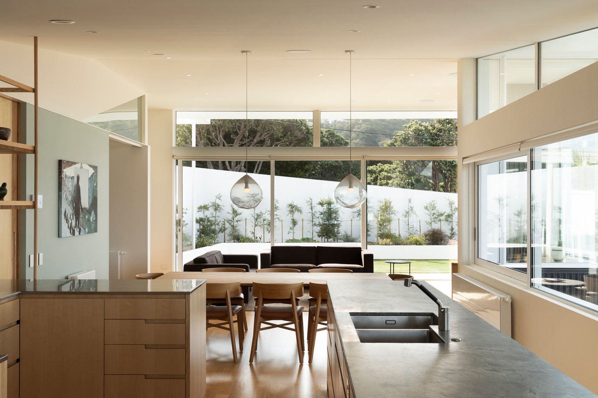 Upstairs, the kitchen, dining and living area leads to an outside terrace and lawn area.