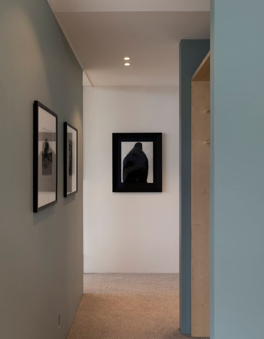 The hallway shows Parsonson's signature colour palette of soft, muted greens and blues.