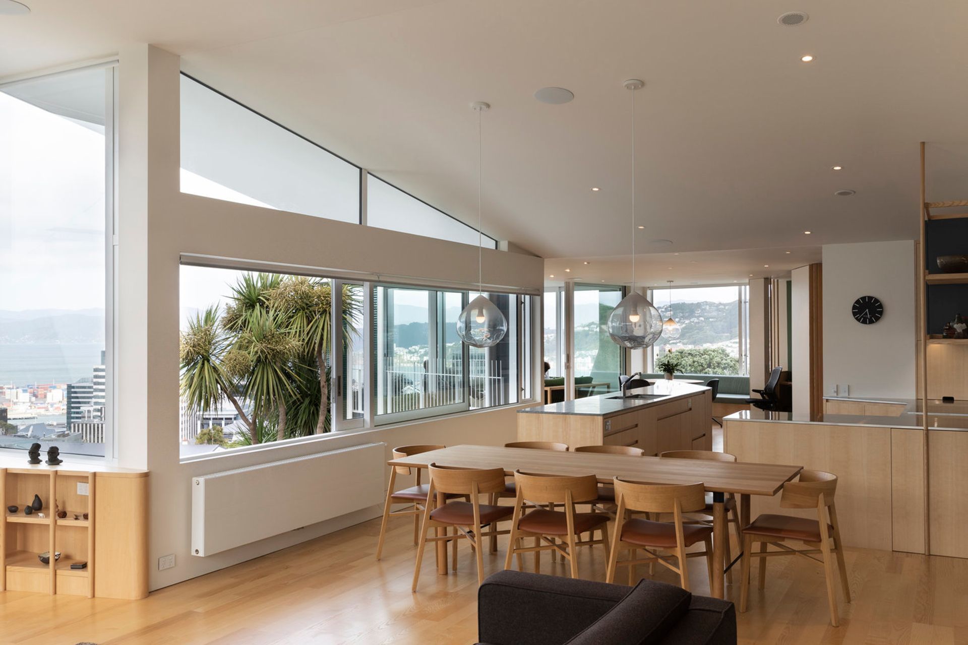 The dining area and kitchen area has a curved plan to take in the panoramic view over Wellington city and harbour.