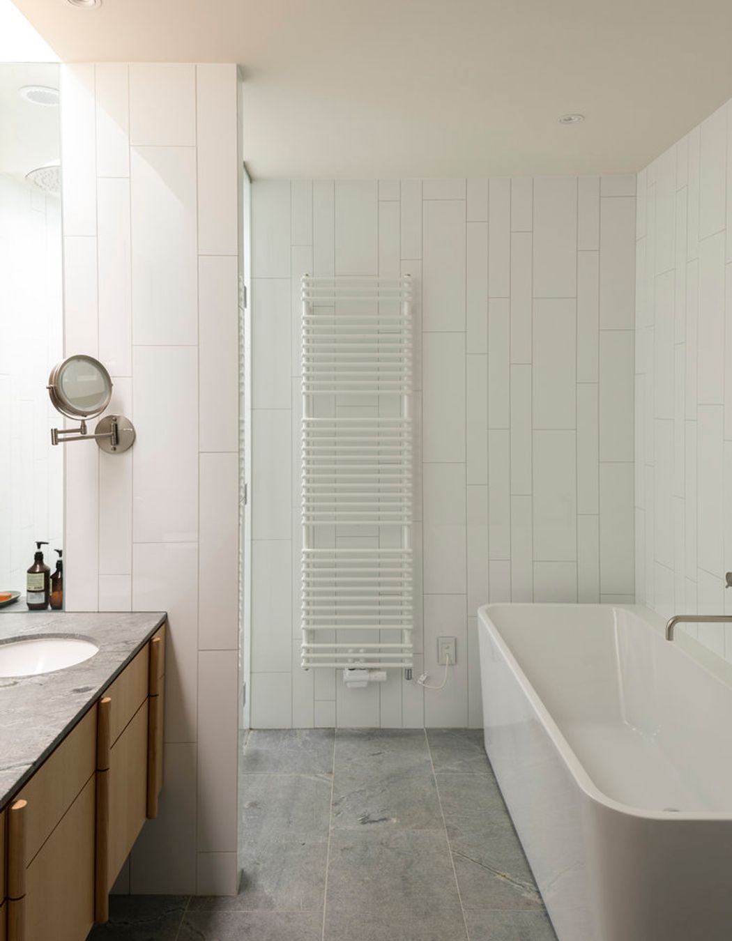 Tiling has been laid out in an irregular pattern, hinting at the verticality of the exterior.