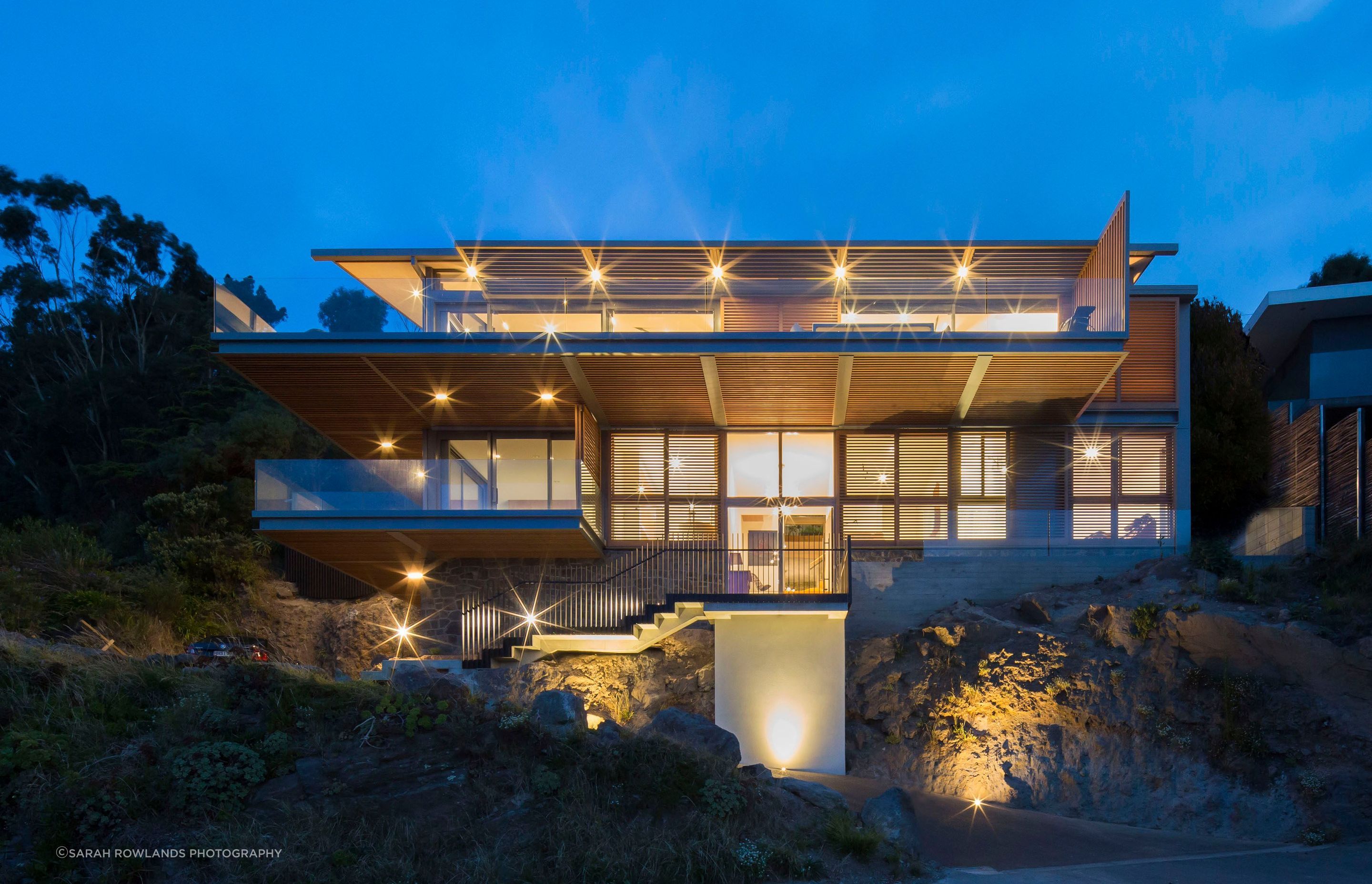 Like a beacon, the house glows at night.