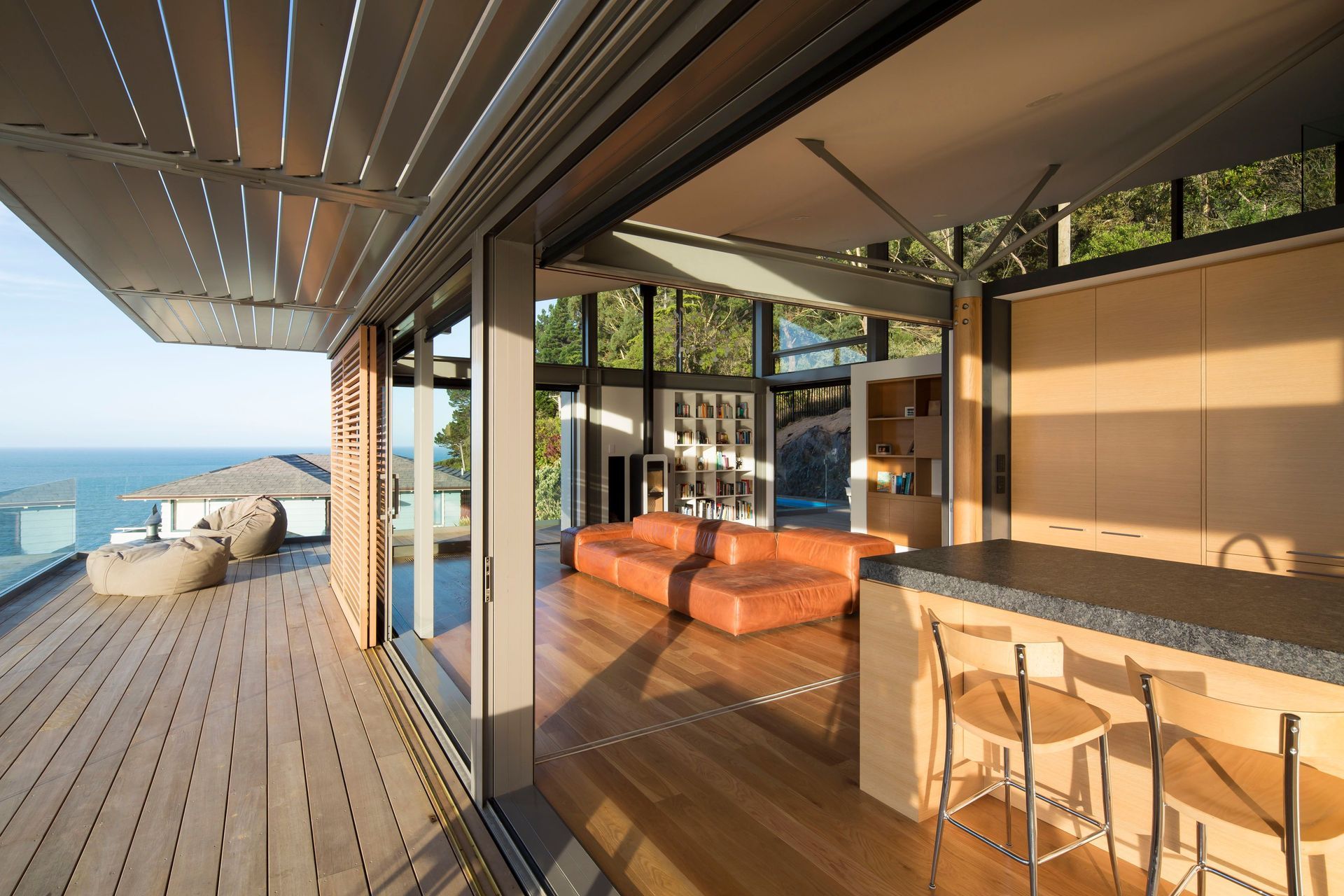 Sliding shutters and automated louvres help mitigate solar gain from the afternoon sun.