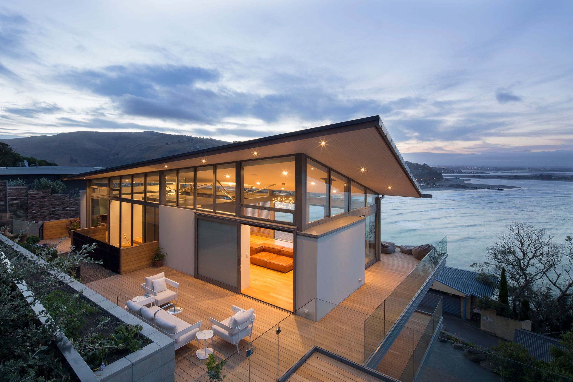 As the sun sets the focus shifts from the external view to the warm and welcoming interior.