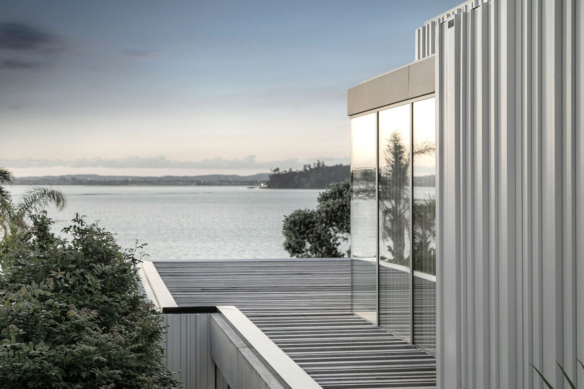 A harbour view across to Auckland's North Shore can be seen from the upper level of the house.