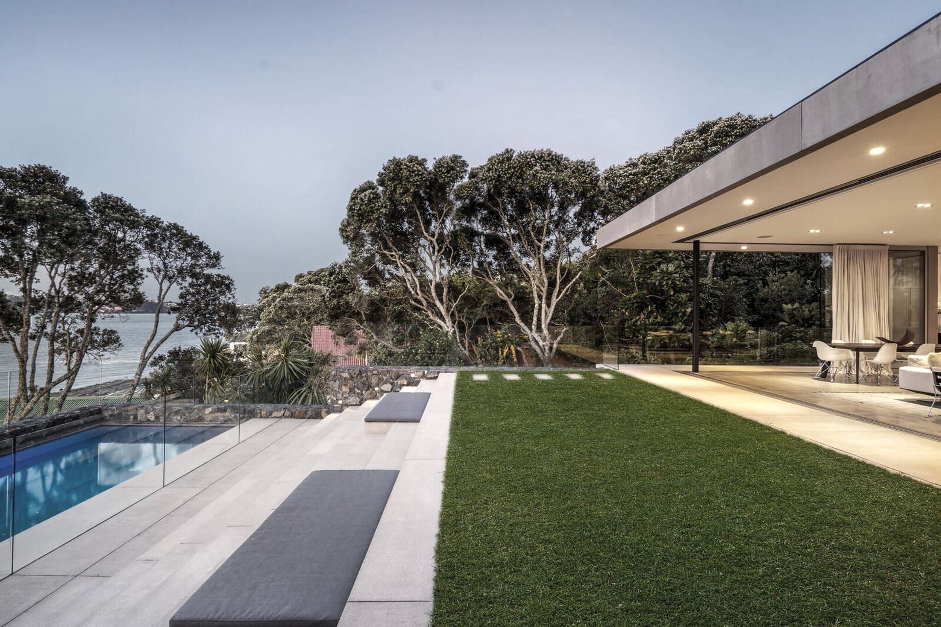 Beautifully landscaped terraces are an extension to the house, forming a lounge, a pool area and a dining space.