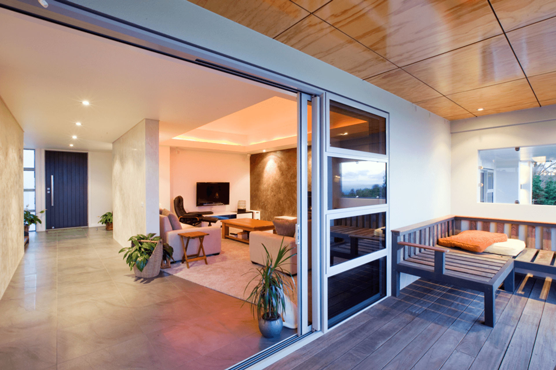 Timber panelled ceilings in the main living spaces also feature this negative detailing.