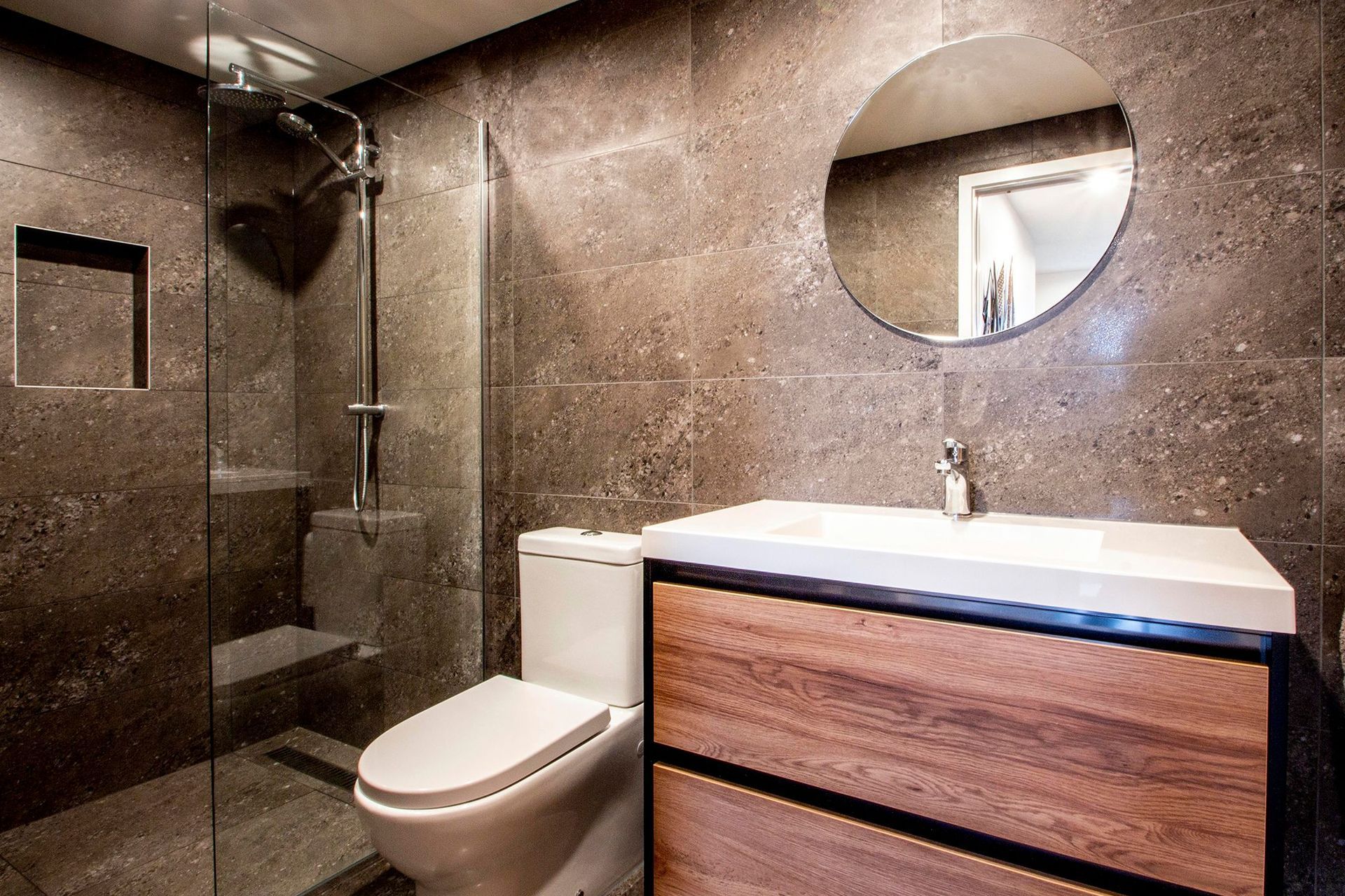 One of the bathrooms utilises natural materials.