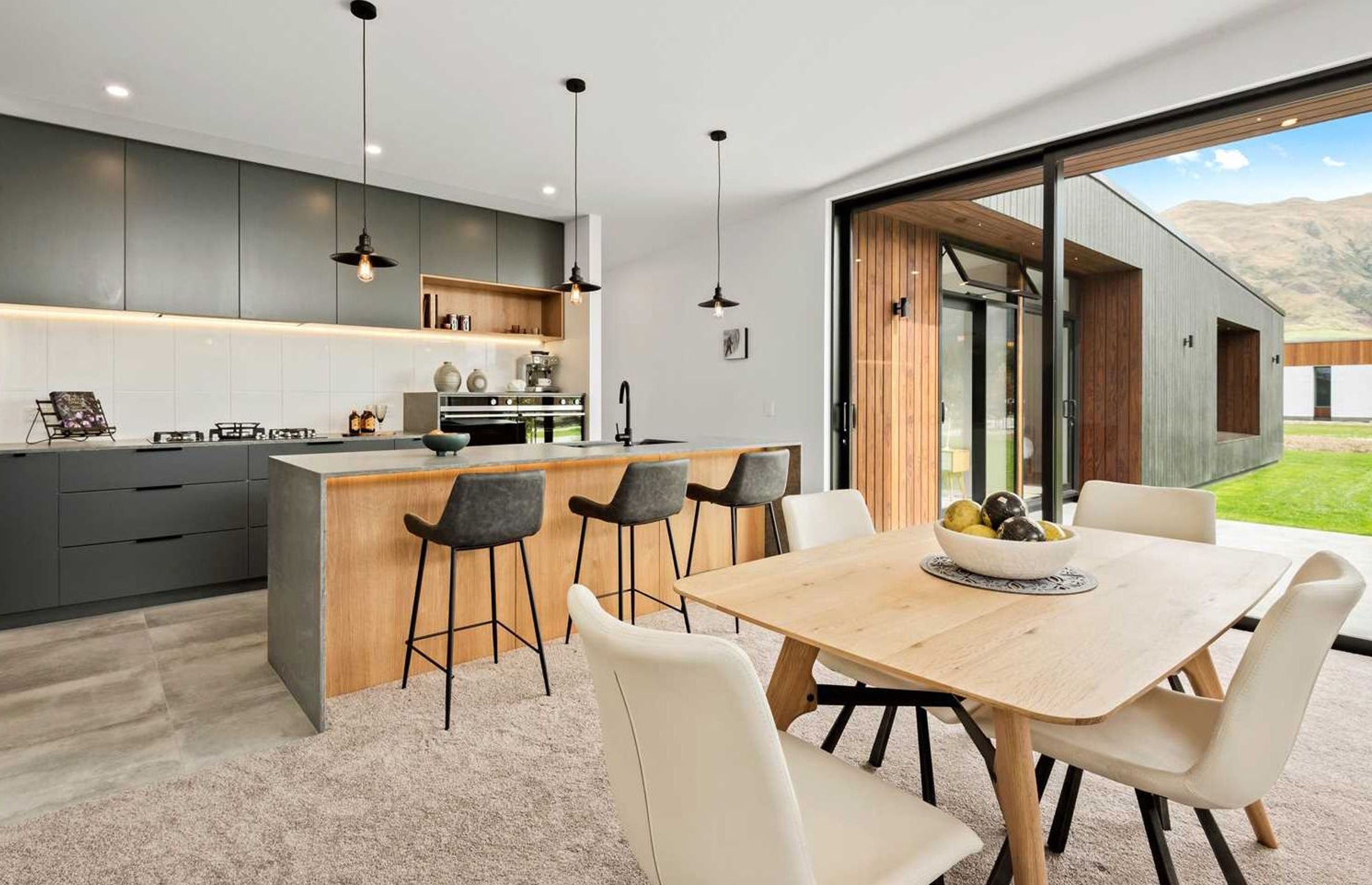 A differently configured kitchen and dining area in one of the other homes.
