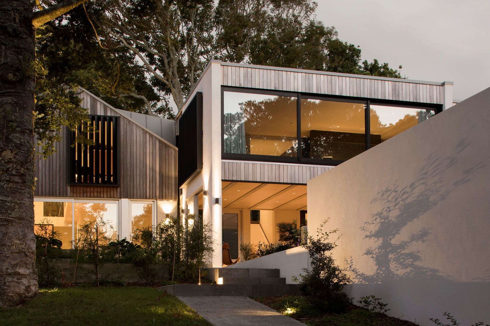 This 159 square metre, the two-level build was constructed with concrete formwork and flooring, with vertical cedar weatherboard detailing.