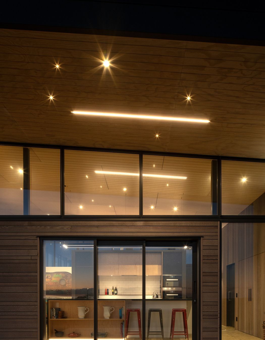 The cantilevered roof helps mitigate solar gain on the west-facing side of the house, which also happens to be where the view is.