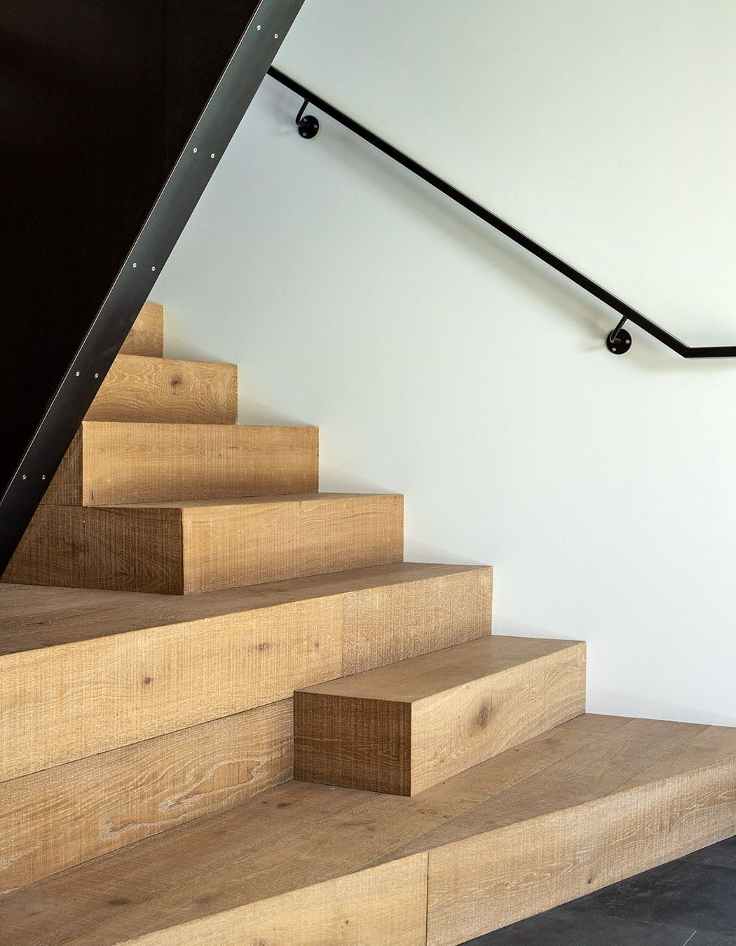 The bottom of the staircase on the ground floor.