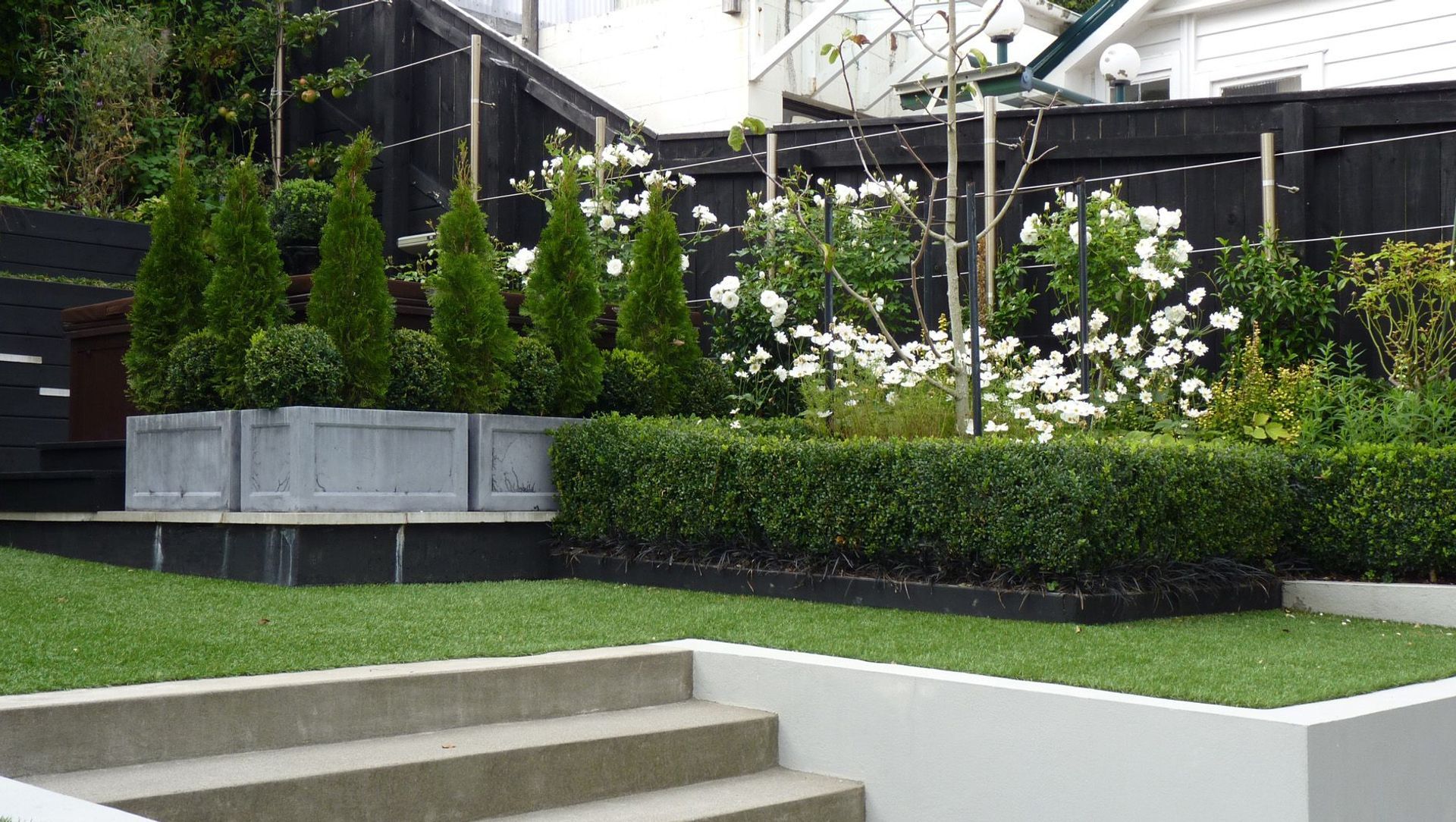 The Glen: stylish family garden with all the toys banner