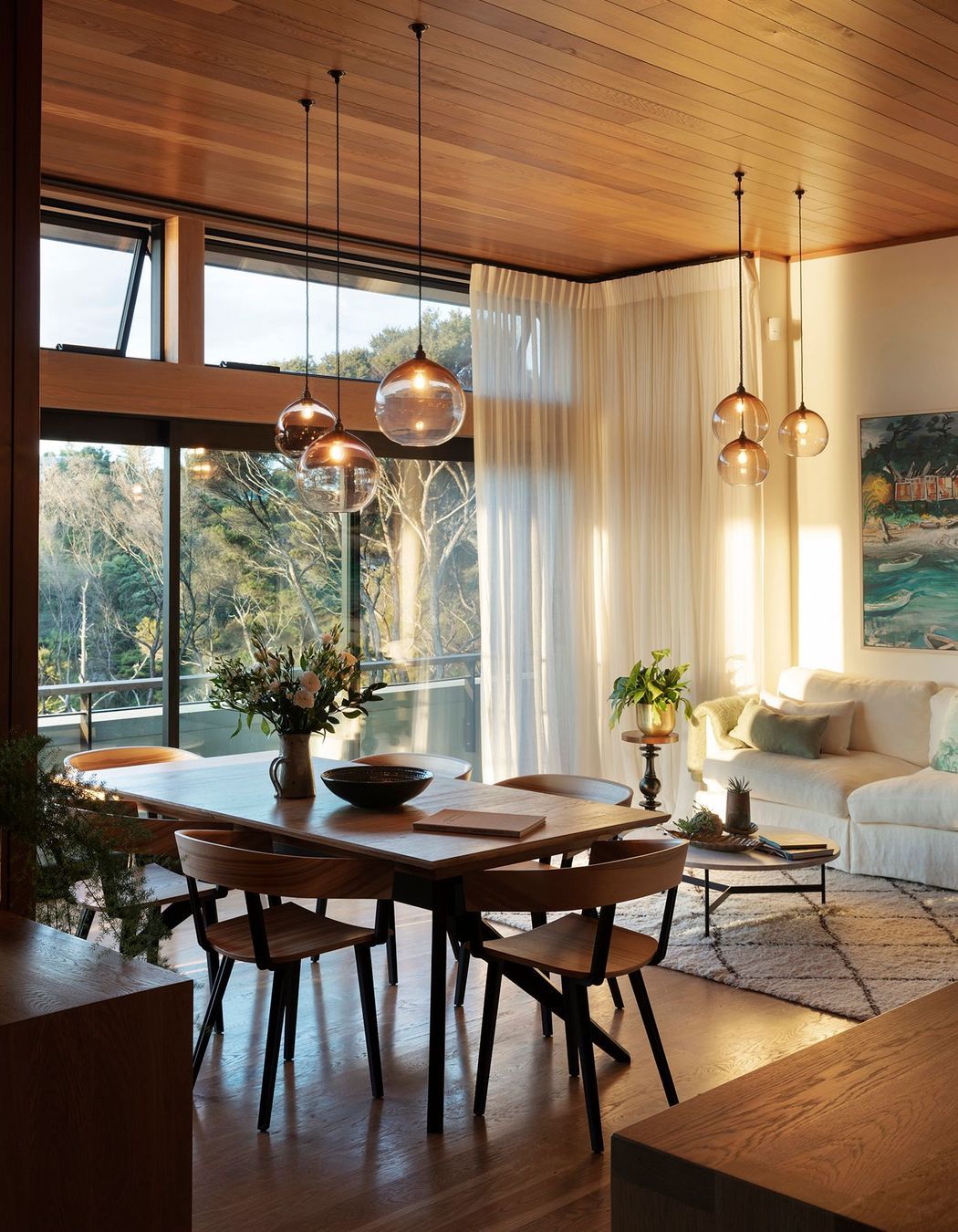 High-level windows draw light into the liviing/dining space during the winter months.