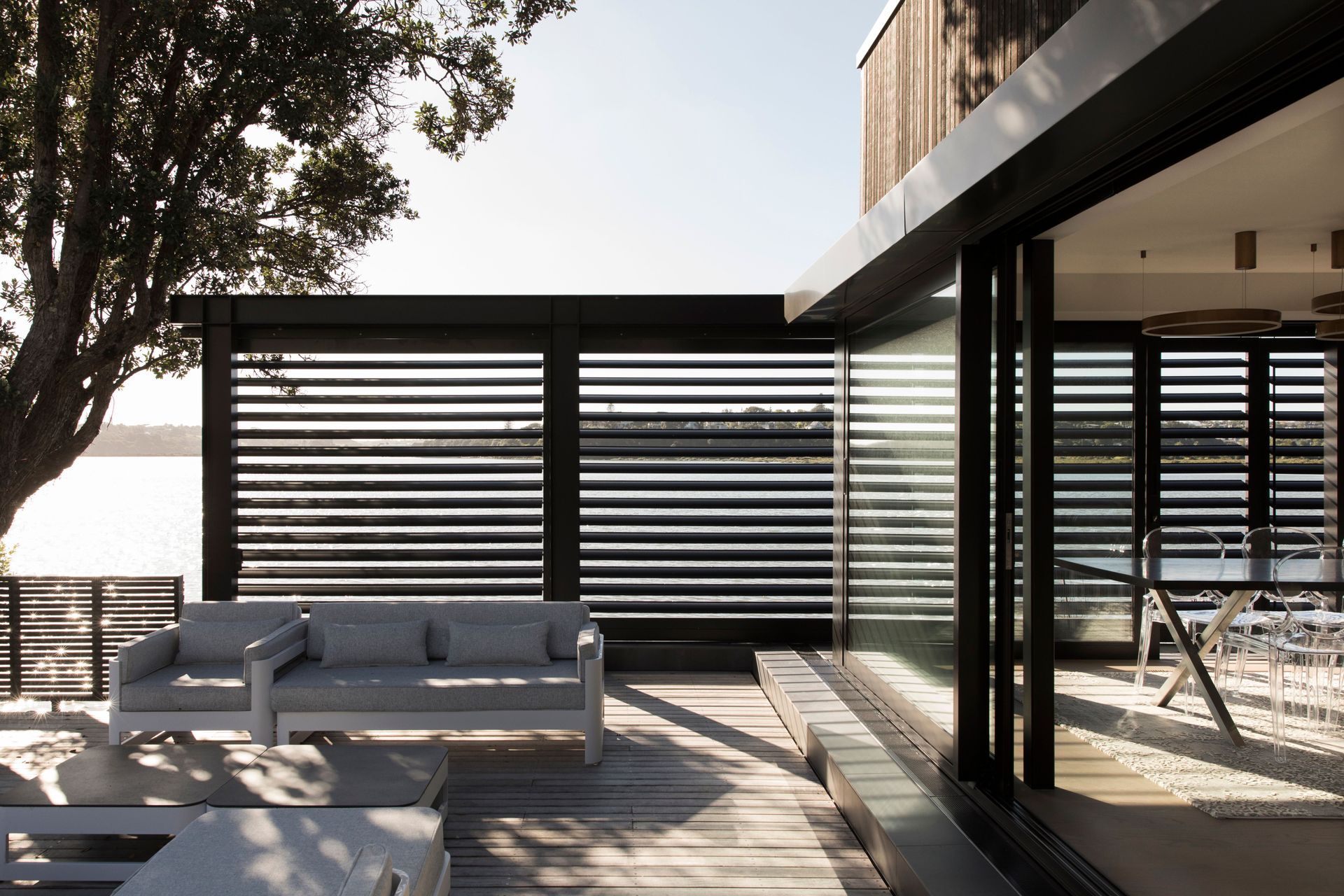 An outdoor room is the perfect waterside place to lounge during the warmer months.