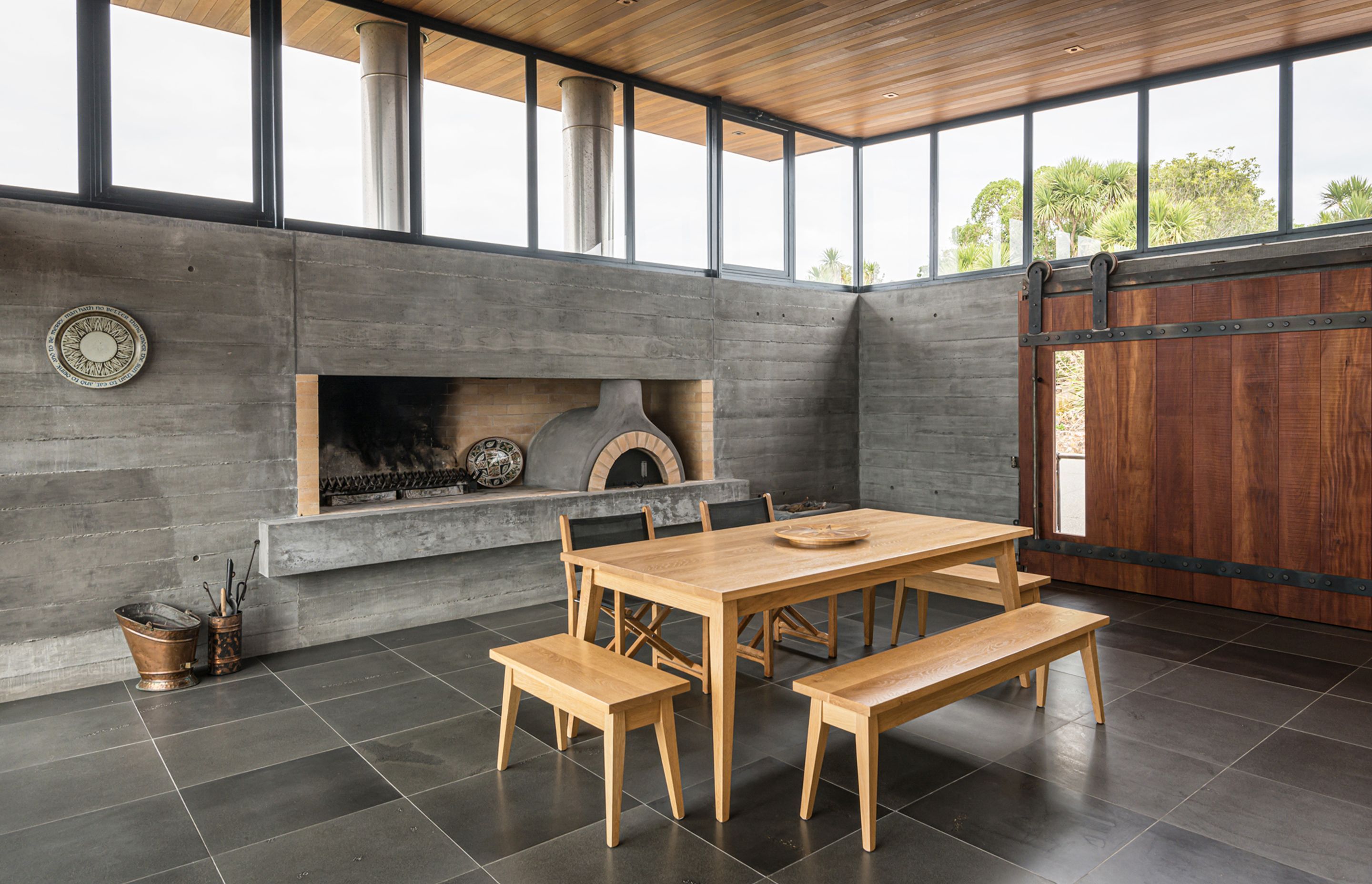 The pizza shop! In the entertainment room, an authentic Italian wood-fired pizza oven was built to satisfy guests. Photograph by ArchiPro.