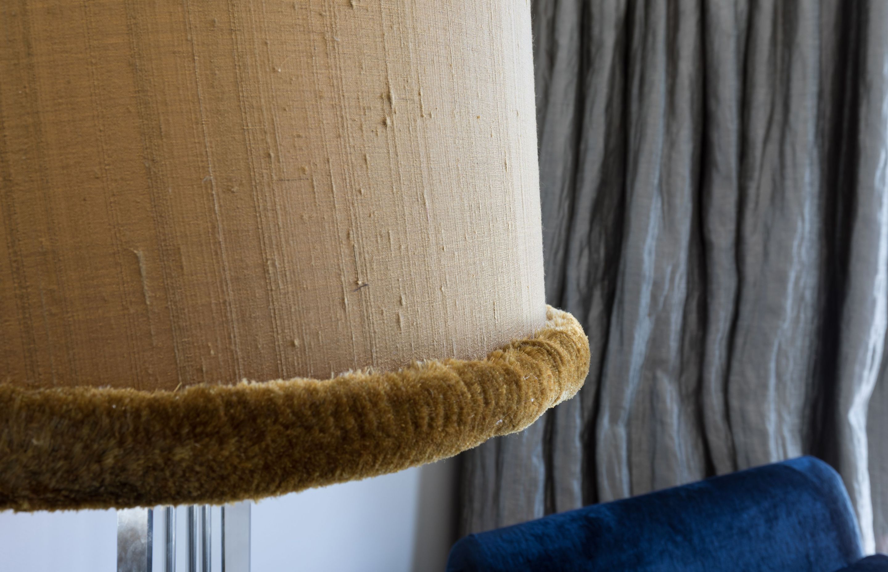 Silk fringing adding a whimsical twist to the floor lamp