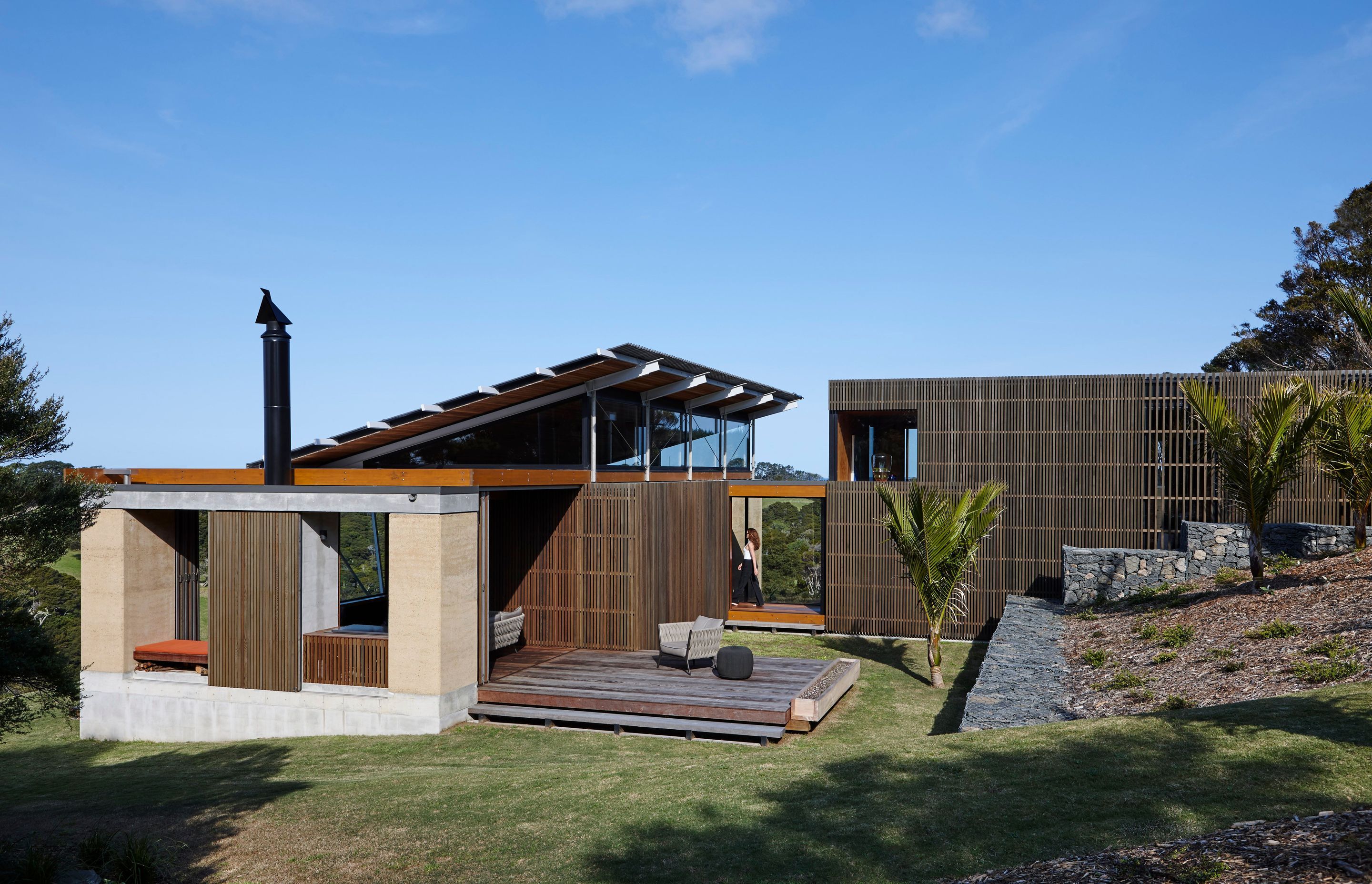 The north-facing elevation shows the pathway leading down to the covered walking and into the home. Photograph by Jackie Meiring.