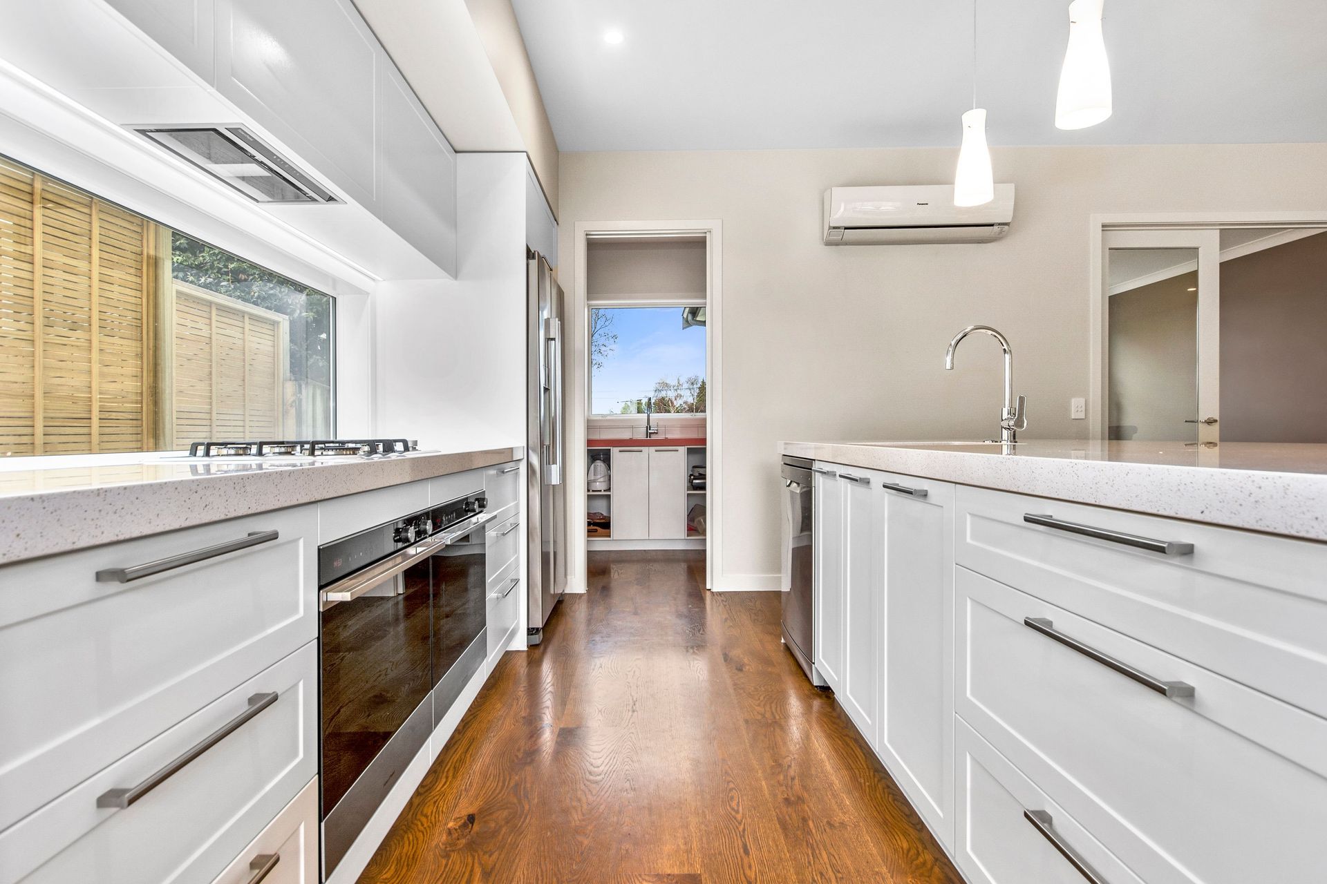 A kitchen designed for entertaining with ceasar stone bench tops.