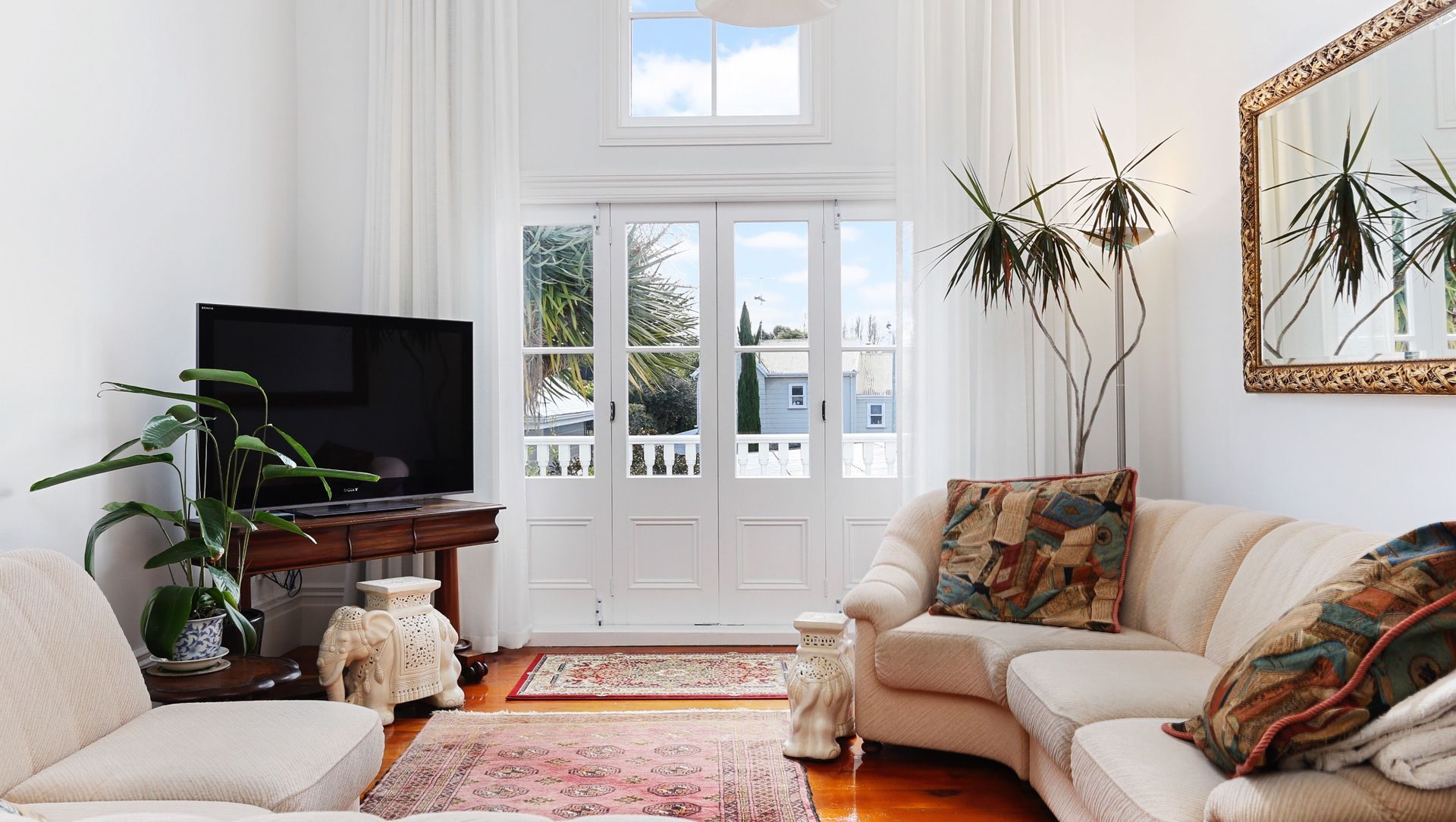 Check out those incredible high ceilings! Final touches done in the living area. 