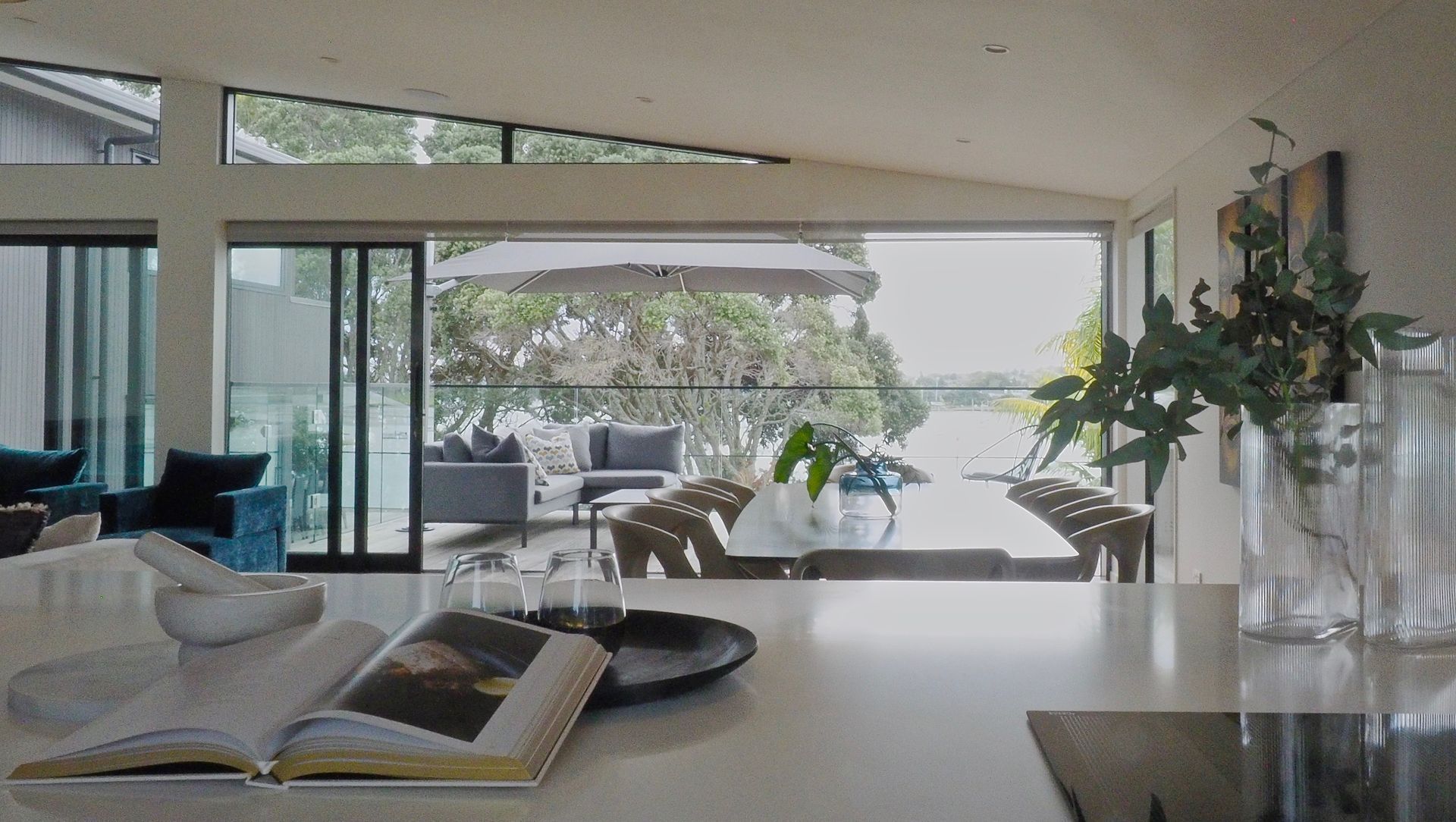 A cooks view through the trees to the harbour.