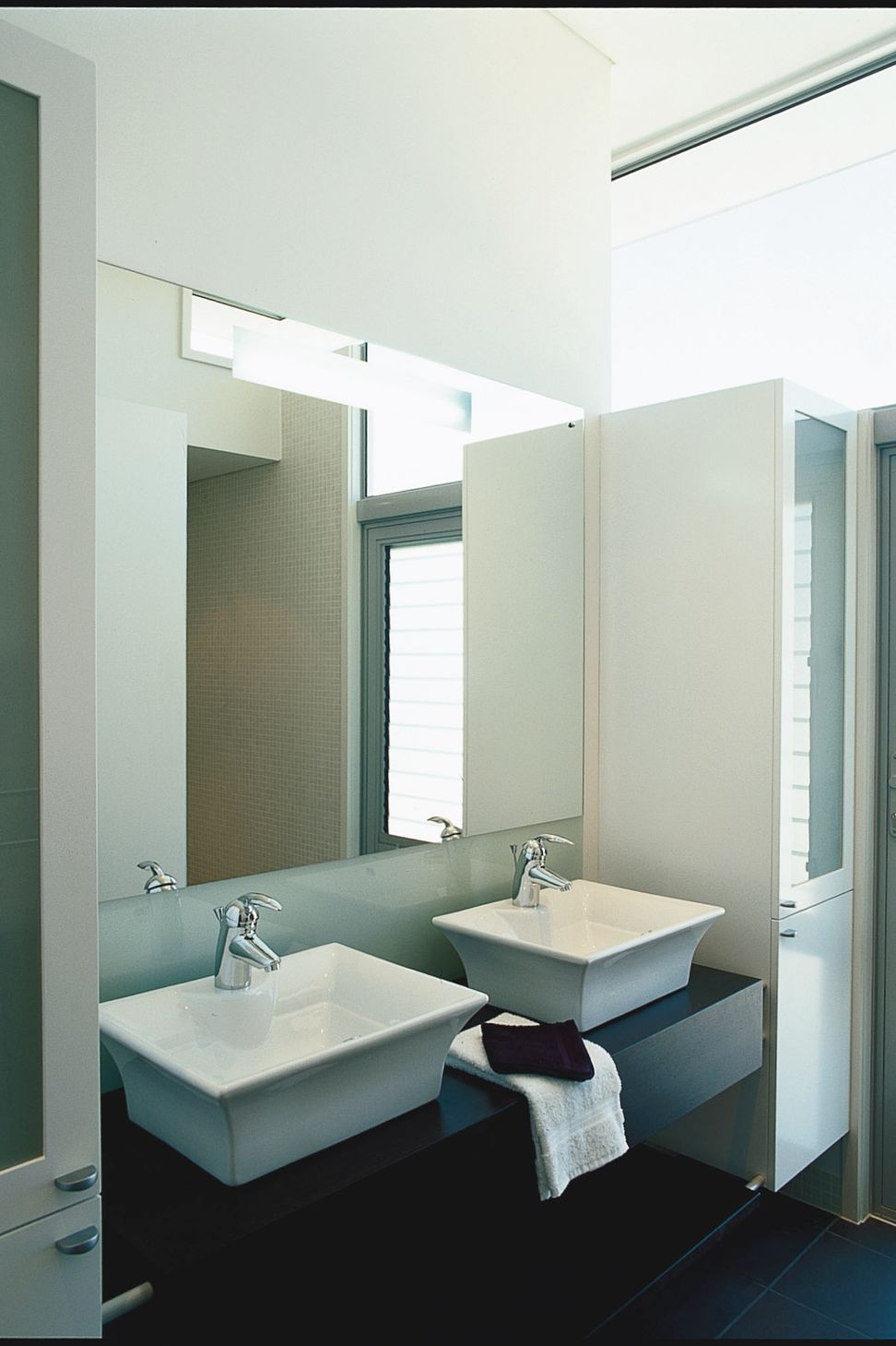 Ensuite Bathroom, mosaic tiled walk-in shower. High level glazing provides an abundance of light without compromising privacy.