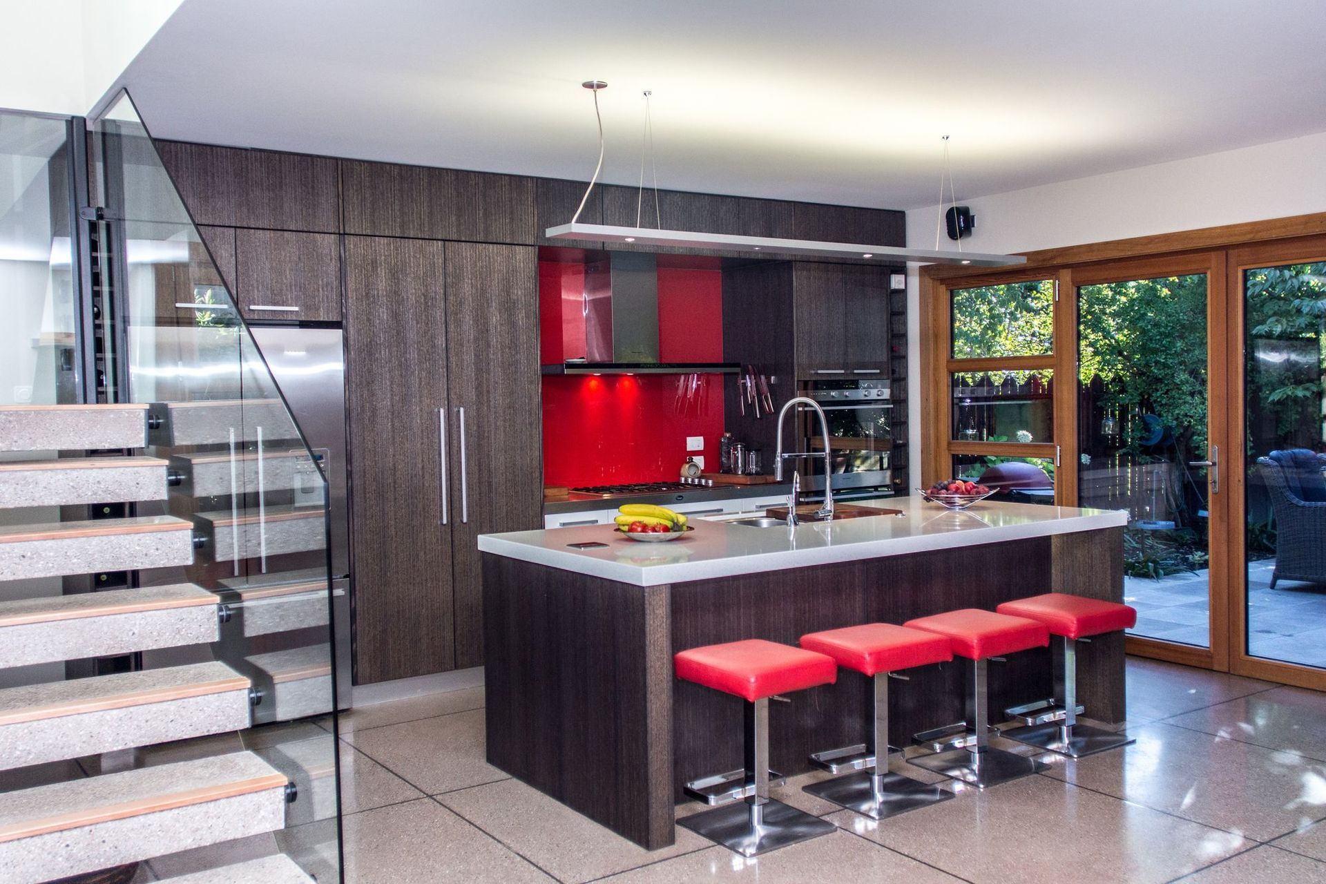 The bright colours of the kitchen add contrast and interest.
