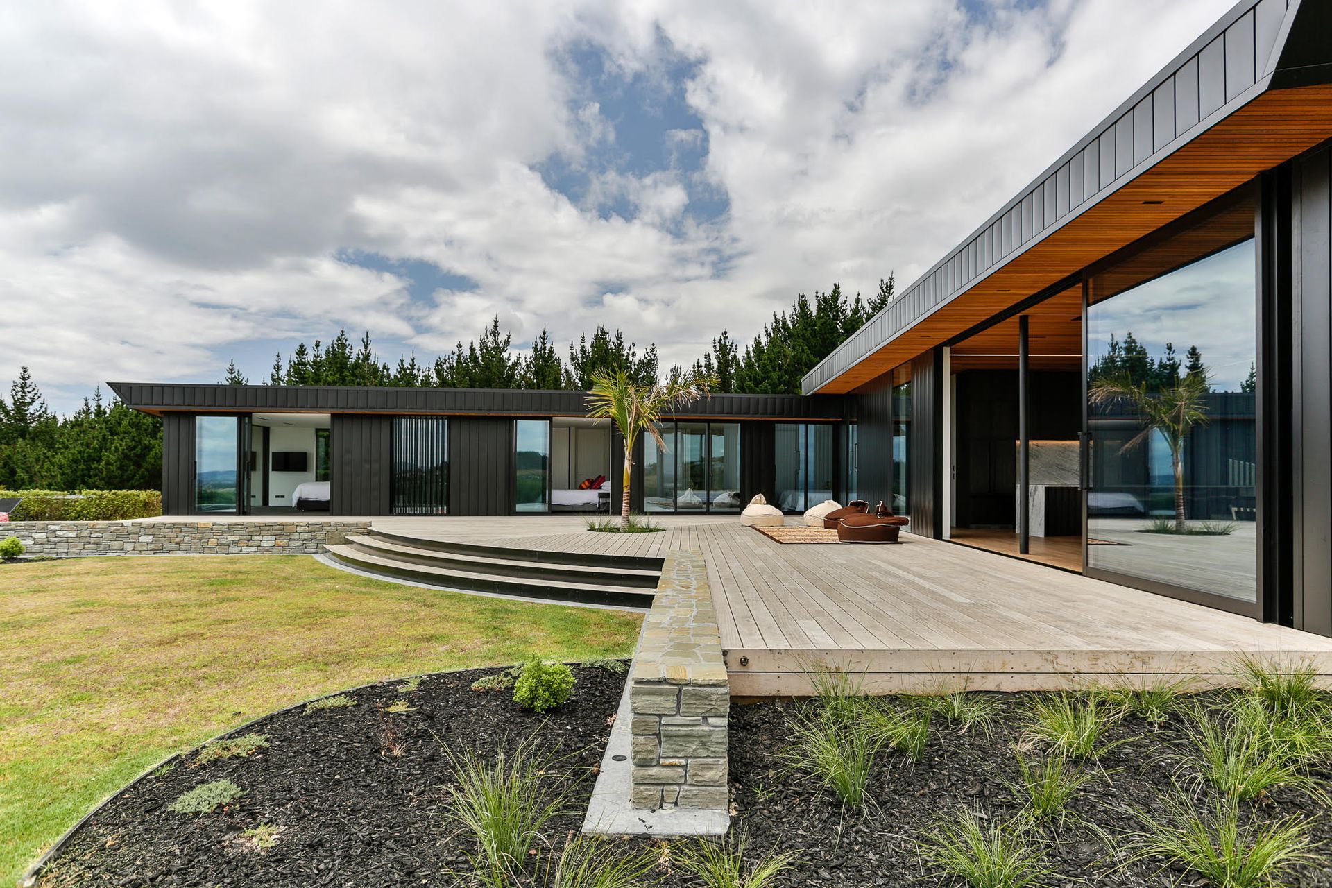 An expansive north-facing deck is one of two outdoor spaces that lead off the living wing, the other is oriented to the southeast.