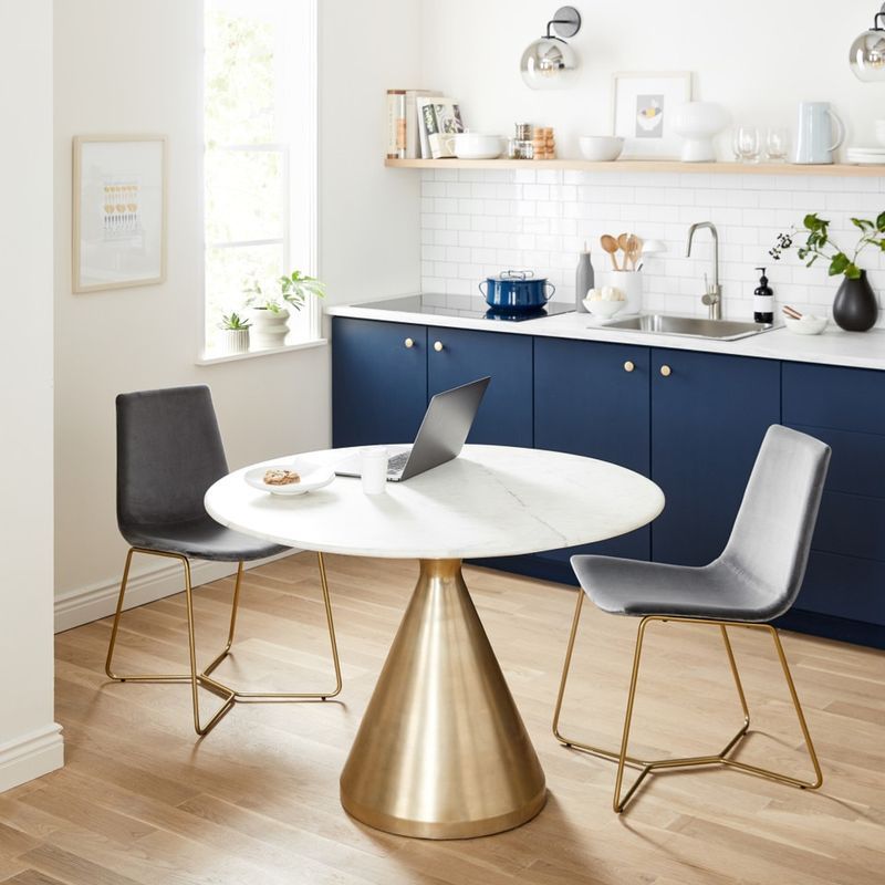 Silhouette Pedestal Marble Round Dining Table