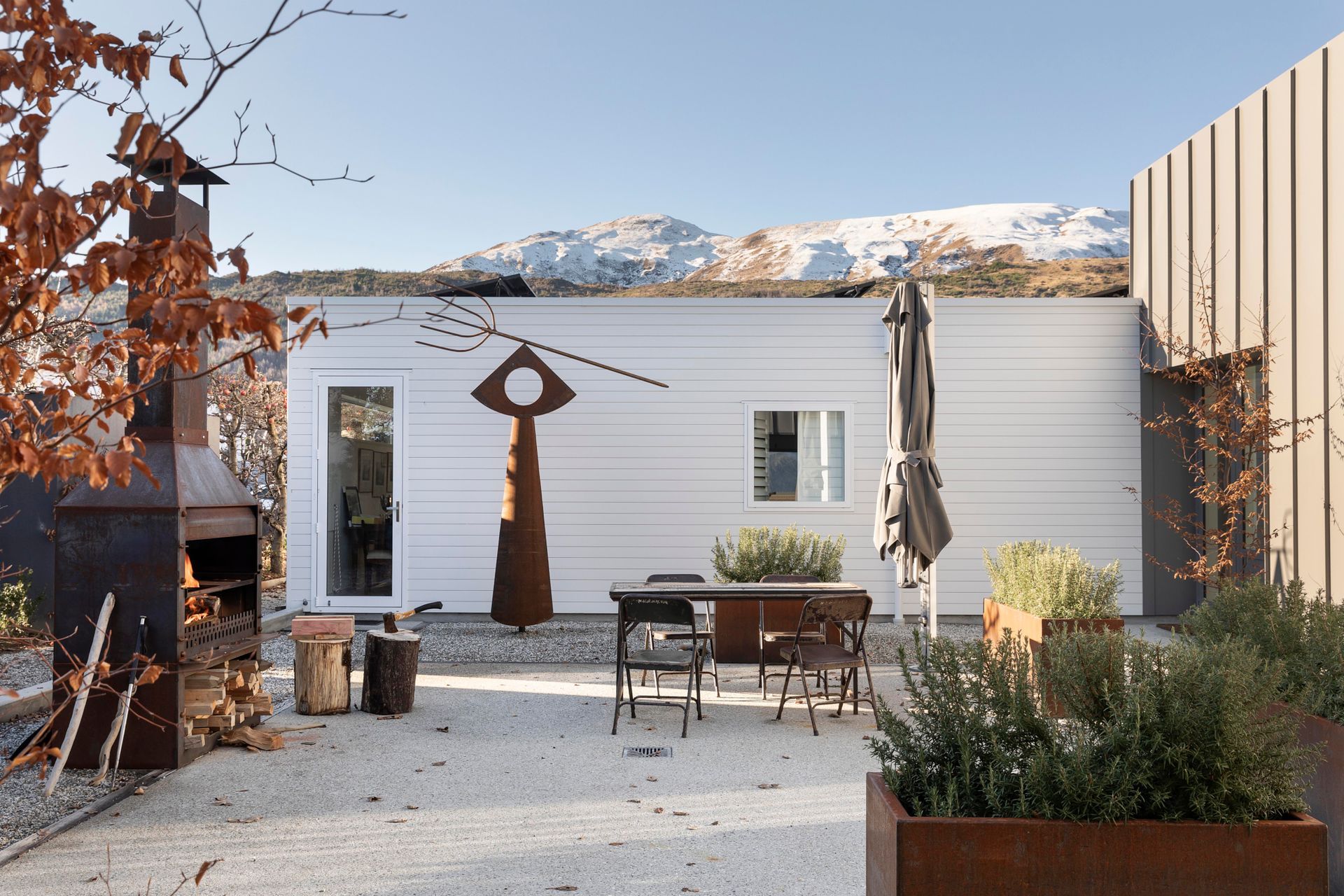 An outdoor fireplace completes the cosy alpine setting.