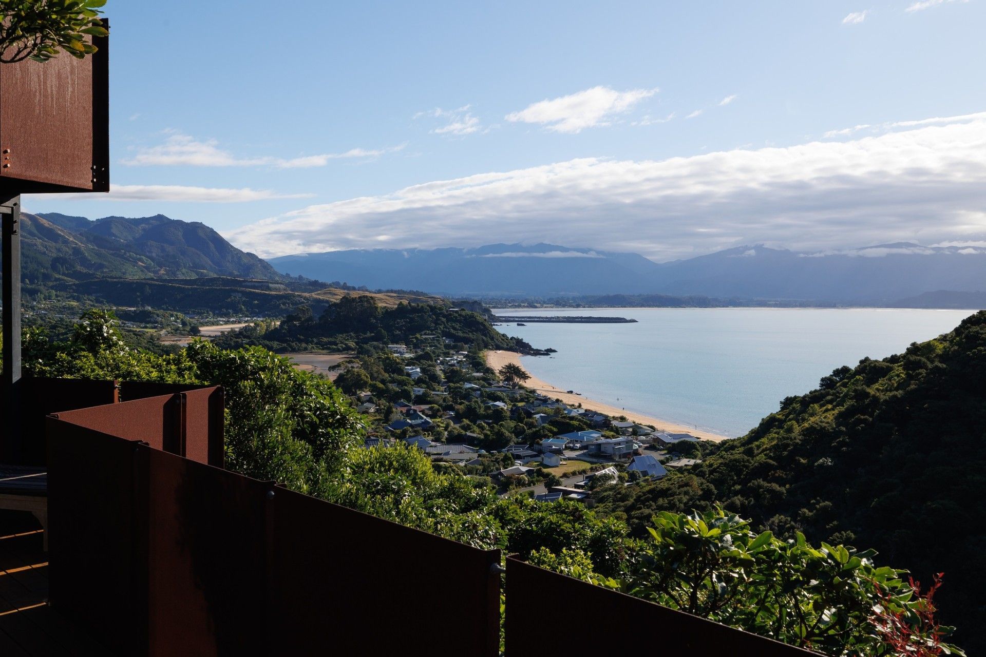 tata-beach-house-06-corten-balcony-view-golden-bay.jpg