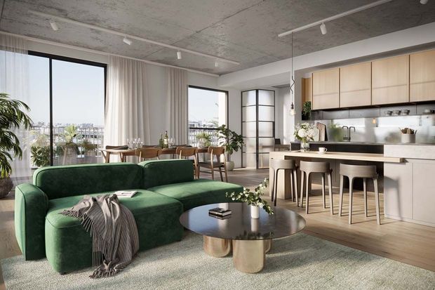 Open-plan contemporary apartment interior combining a living room, dining area, and kitchen. The space features a deep green sectional sofa, round dark coffee table, light timber flooring, pale cabinetry, large black-framed windows, sheer curtains, a concrete-textured ceiling, and linear track lighting. A balcony or city view is visible beyond the glazing.