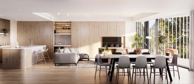 Bright open-plan contemporary apartment interior combining a compact kitchen with a stone island, integrated timber-look cabinetry and shelving, a living area, and a dining zone. Full-height vertical glazing with sheer curtains brings in abundant daylight, while warm timber flooring and neutral furnishings create a refined, inviting atmosphere.
