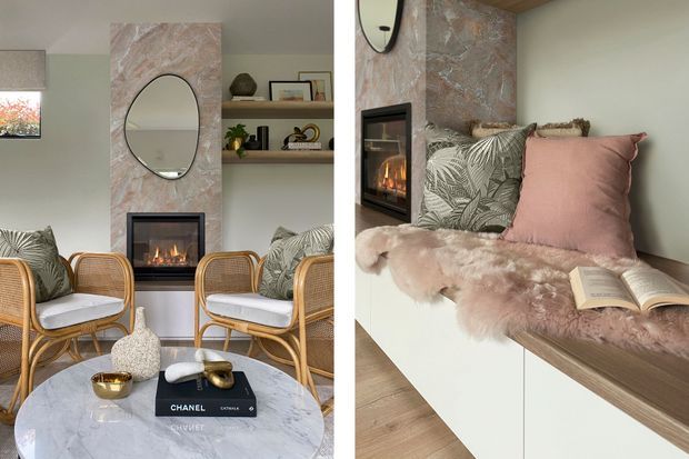 A split view of a refined living room featuring a marble-clad fireplace wall with an inset firebox, oval mirror, open display shelving, rattan lounge chairs, patterned and blush cushions, and a round marble coffee table. The second view shows a built-in window seat beside the fireplace, styled with a pink faux-fur throw, cushions, and an open book. The palette is soft and warm with natural textures and contemporary detailing.